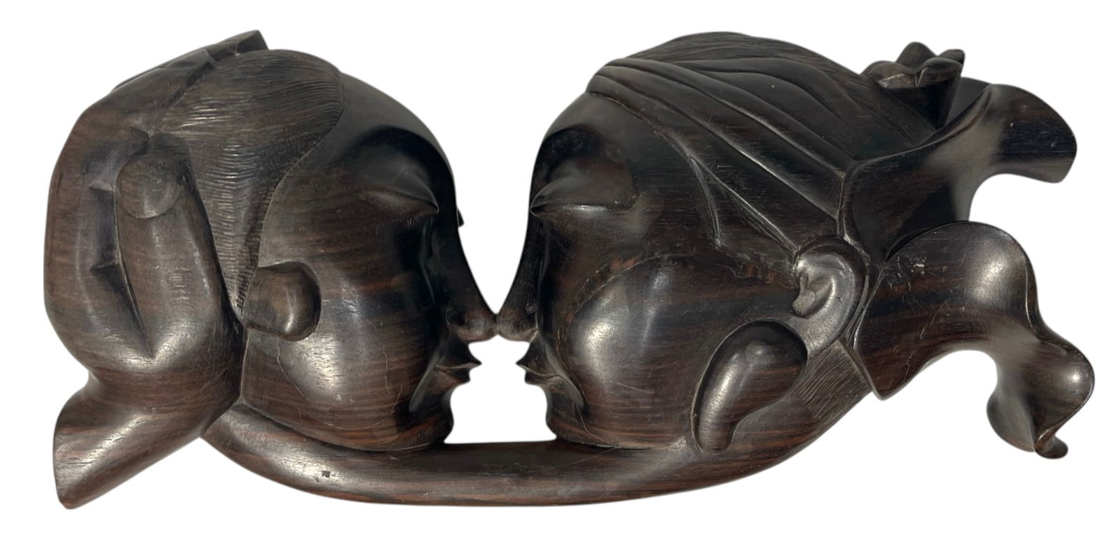 Wooden Sculpture Depicting Two Faces in a Kiss: Wooden Sculpture Depicting Two Faces in a Kiss