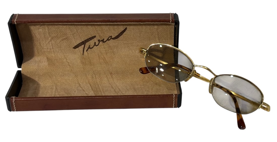 Tura Sunglasses Featuring a Gold Toned Metal Frame: Tura Sunglasses Featuring a Gold Toned Metal Frame