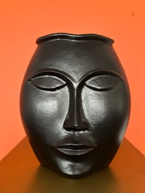 Metal modernist face vase
