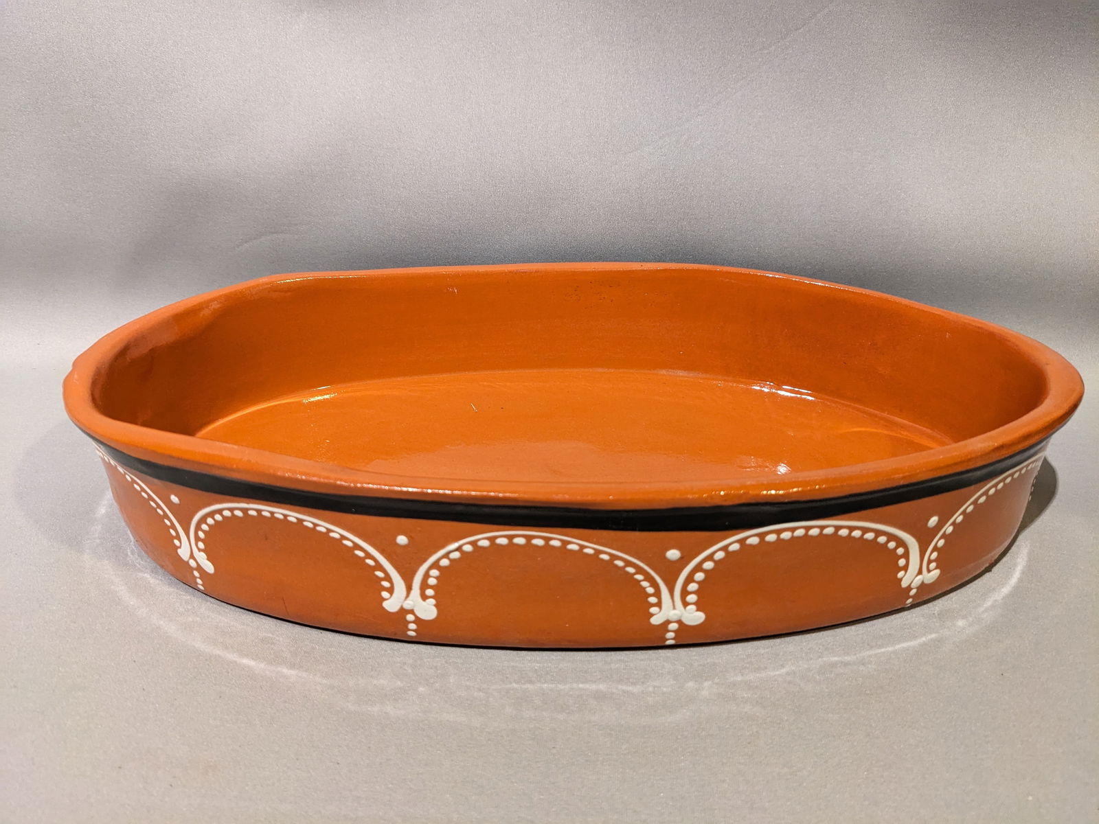Portguese Terracotta Dish: Portguese Terracotta Dish.2.5" x 9" x 0.5"Made in PortugalIn-house shipping is available for smaller items. Shipping is available for larger and other fragile items through Pac Mail, which is a local