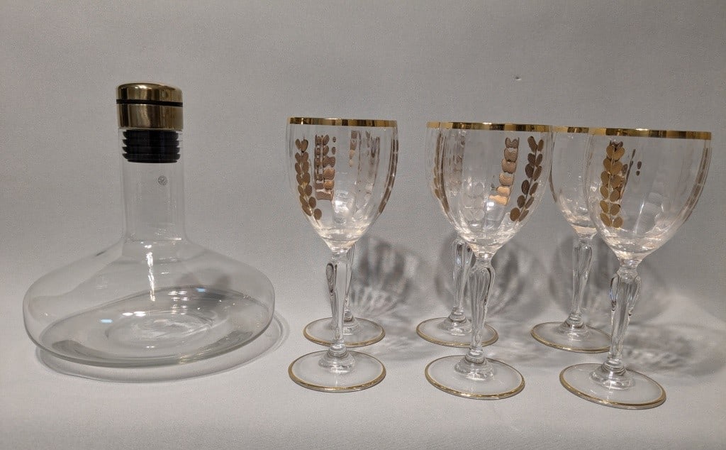 Mid Century Modern Decanter & Wine Glass Set: Mid Century Modern Decanter & Wine Glass Set.9" x 8"In-house shipping is available for smaller items. Shipping is available for larger and other fragile items through Pac Mail, which is a local