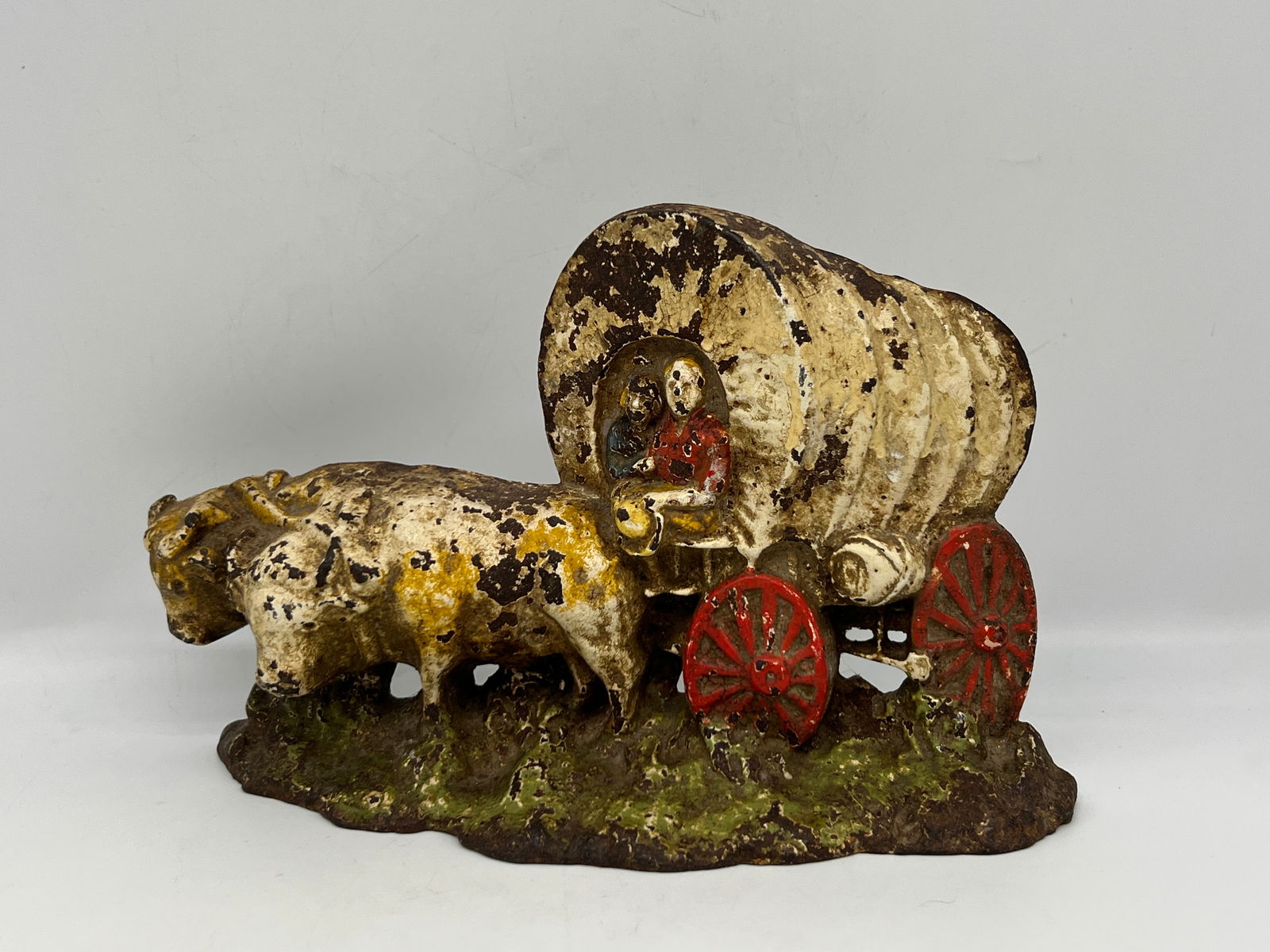 Antique Wagons West Conestoga Covered Wagon Cast Iron Doorstop: Oxen, Pioneers, & Wagon made by LVLDesign # 64Height 6.25Length 10.25Markings:Copyright C in circle64