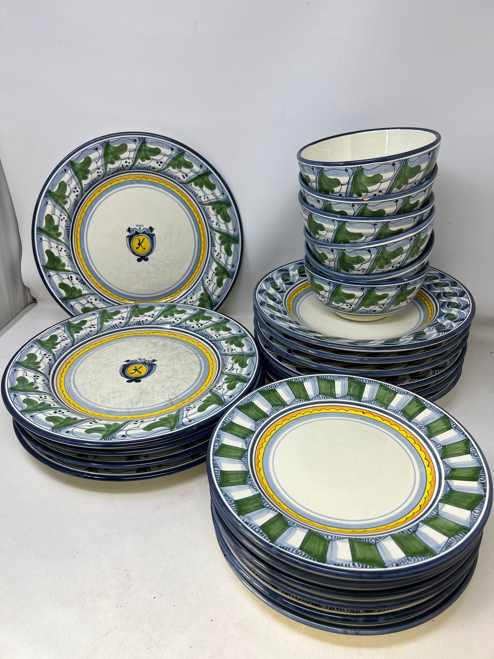 Artist Made Italian Pottery Rampini Radda Dish Set: Salad Bowls, Bread Plates in great condition. Dinner Plates have silverware stratches, some soup bowls have chips