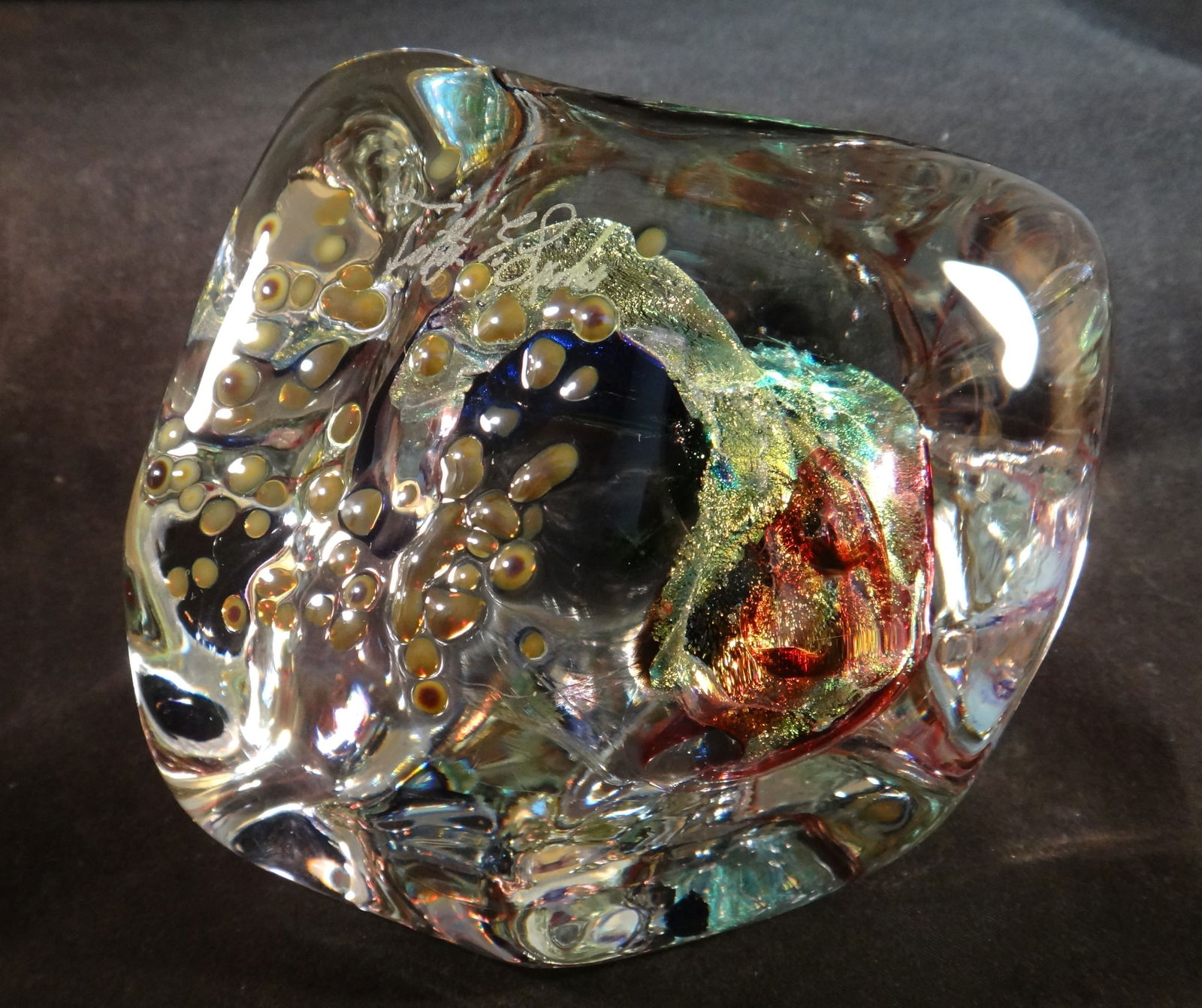 Timothy E. Landers Art Glass Sculpture/Paperweight, Iridescent, Signed. 3 ¾”x 4”: Vintage Timothy E. Landers Art Glass Sculpture/Paperweight. Features clear glass with a stunning iridescent center artwork. Measures approx. 3 ¾” tall x 4” at the widest. Signed above
