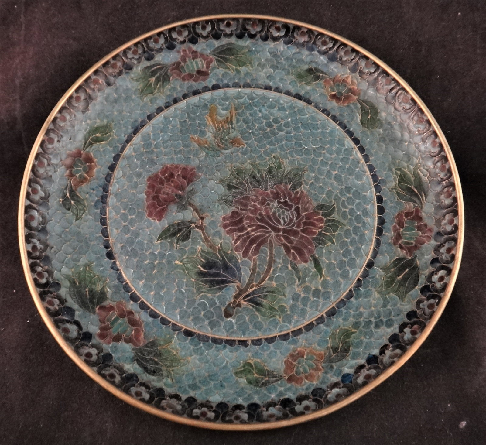 Vintage Chinese Plique A Jour Cloisonné Enamel Plate: Vintage Chinese Plique A Jour Cloisonné enamel 6 1/8” plate with central design of peonies with a bird & floral Border. Fish scale cloisonné design.