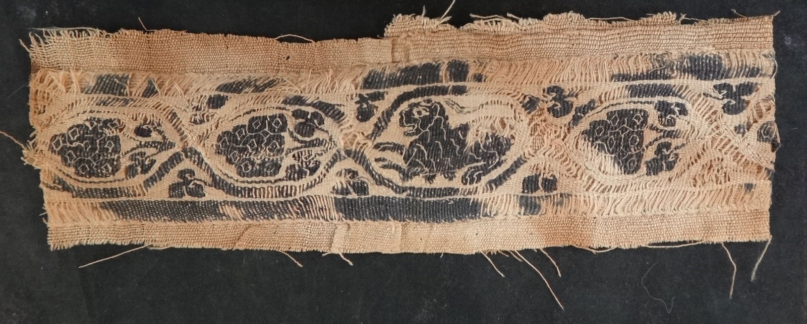 Ancient Byzantine Coptic textile fragment band w/feline & fruit, 6 3/8” x 2". (1 of 2)