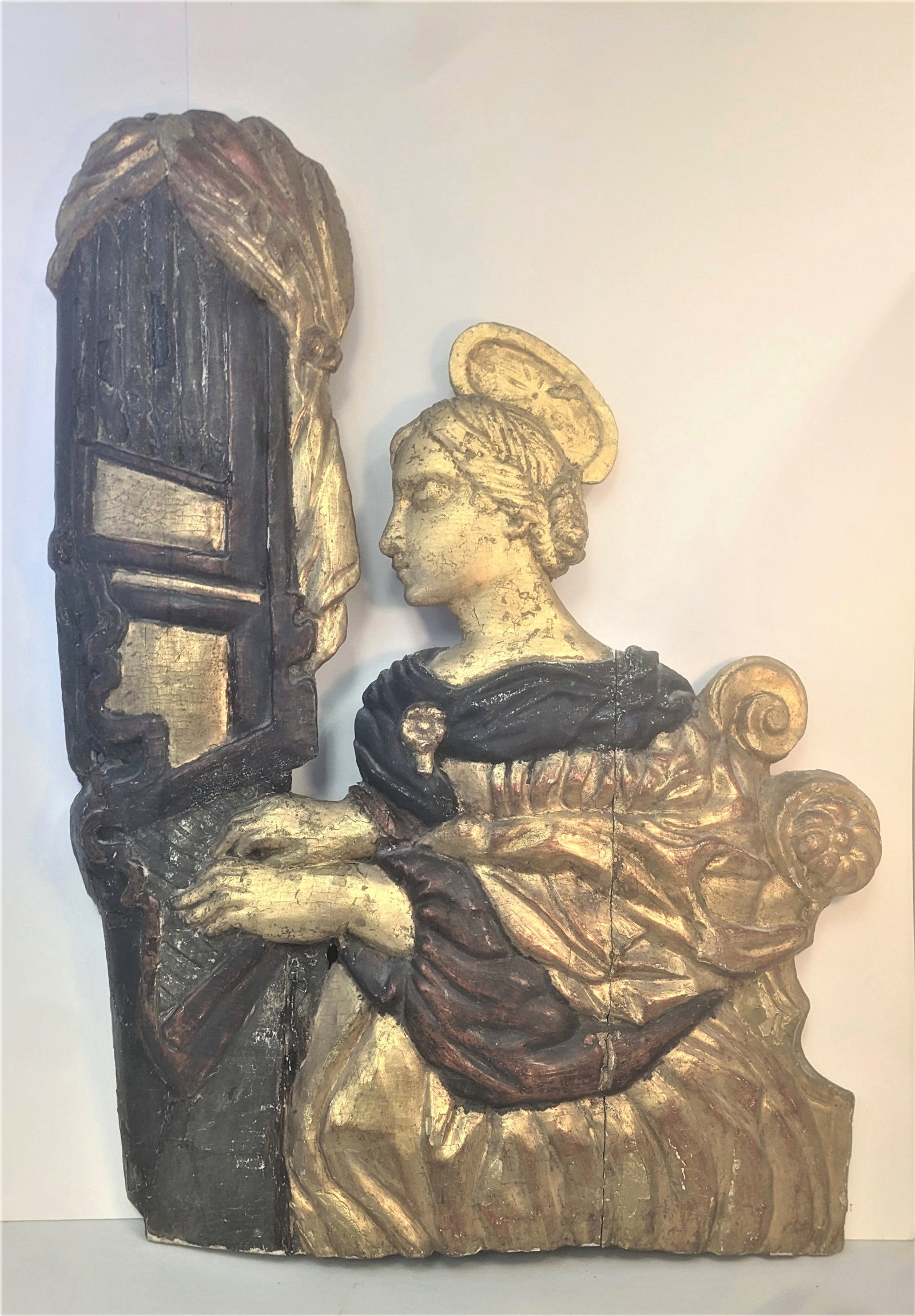 18th cent. European Carved Wood Broadside -Woman Playing an organ,: 18th cent. European Carved Wood Broadside depicting a woman with halo playing an organ featuring 24k gold=leaf & paint. 27” x 20”.