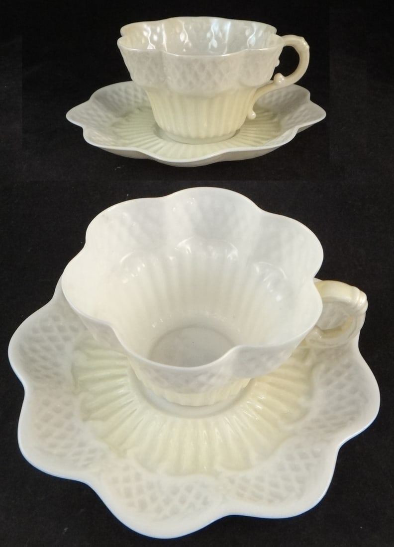 Pair Irish Belleek Eggshell 2nd Black Mark Porcelain Cups & Saucers: Very Rare Pair of Irish Belleek Eggshell Porcelain Cups & Saucers in Cream Color Cob Luster with a Basket Weave Border, Erne Series. Possibly once part of a Cabaret Tete-a-Tete Tea Service. Cups are 4
