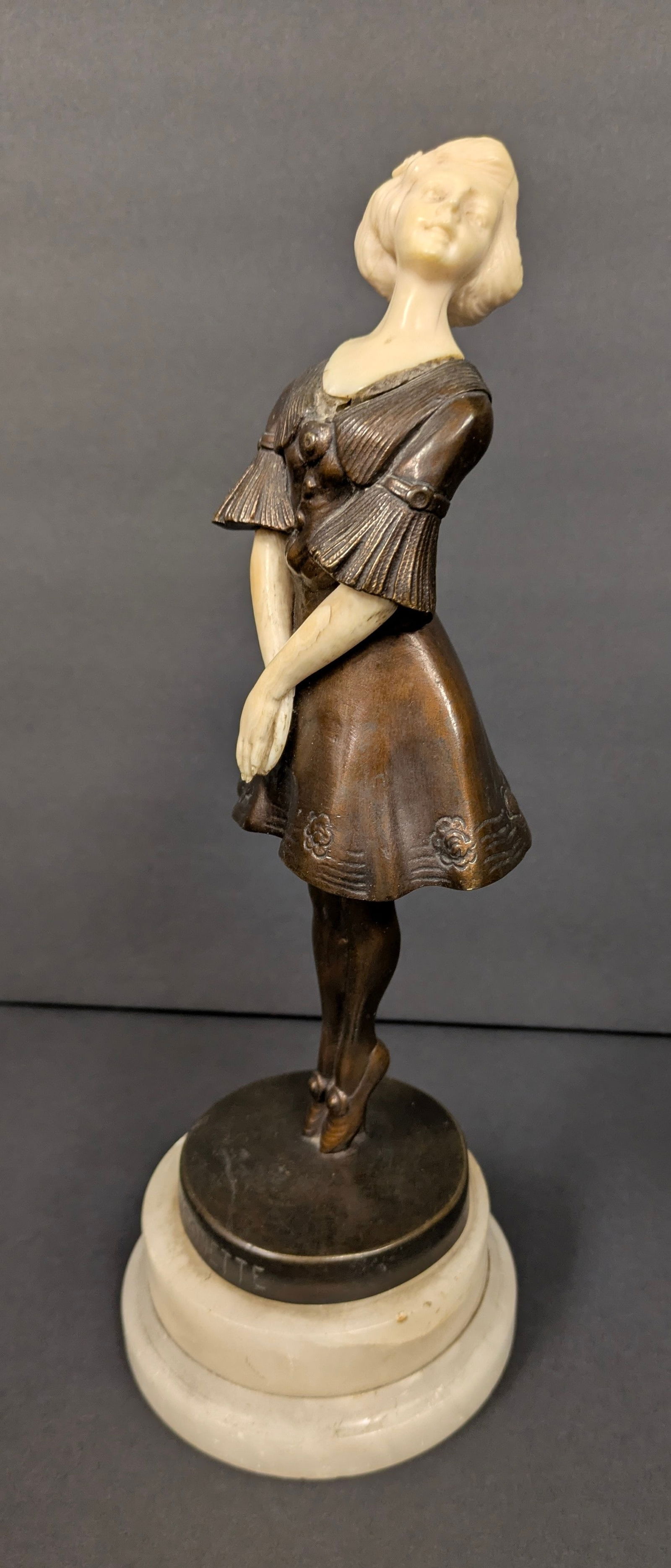 1920’s French Art Deco Bronze Figure of a Standing Young Woman: Pinsonette (Finch).: 1920’s French Art Deco Bronze Figure of a Standing Young Woman on her Toes with carved tusk head, neck & arms. Titled: Pinsonette (Finch). Unsigned, attributed to Paul Philippe. Great Pose. Engraved