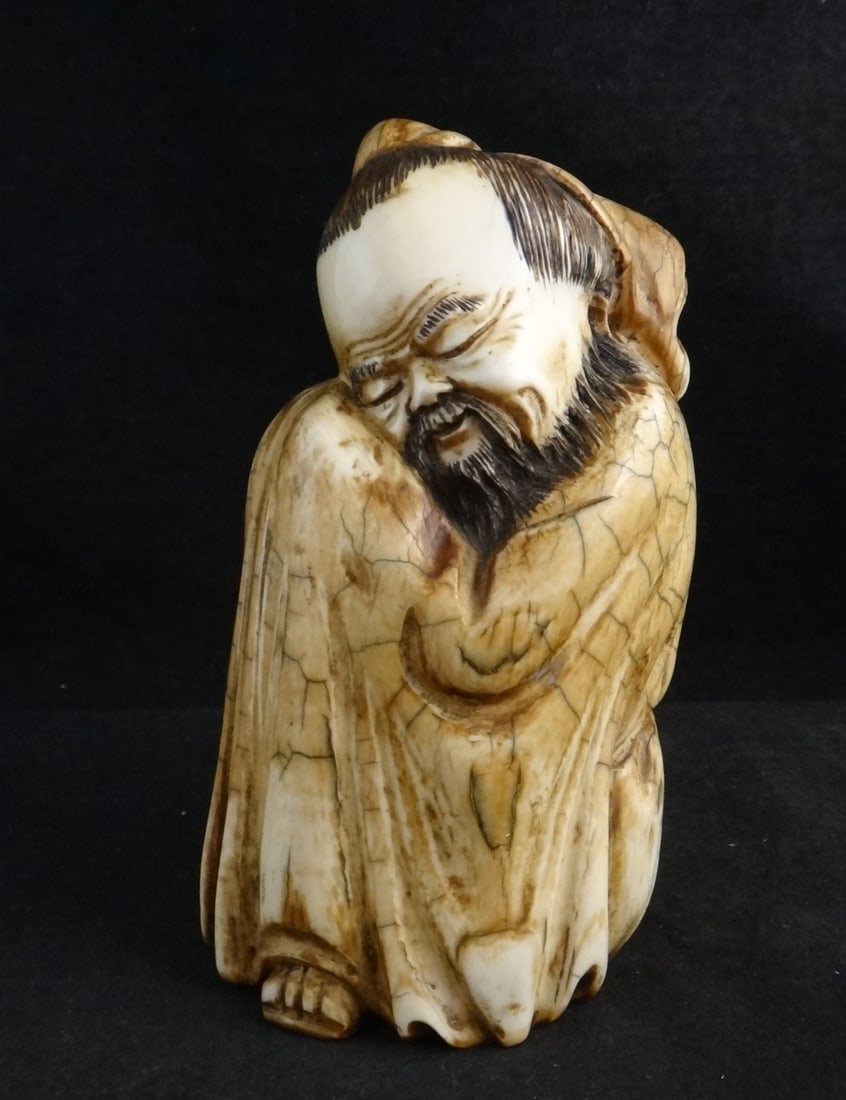 Ancient Beautifully Carved Mammoth Tusk of a sleeping Buchan: Ancient Beautifully Carved Mammoth Tusk Featuring a sleeping Buchan with Apocryphal Ming Dynasty mark. 5” tall, base is 2 ¾” x 2 ¼” dia.