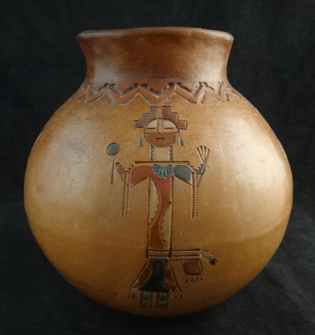 Vintage Native American Indian – Navajo Pottery Vase by Irene White.: Vintage Native American Indian – Navajo Pottery Vase by Irene White. Features red slip with 4 figures painted in multi-color etched into the sides. 4 ¾” dia. x 4 ¾” tall. S