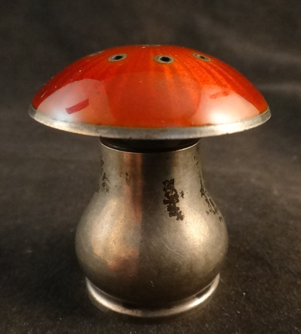 1950’s Norway Sterling & Enamel Salt Shaker w/Red Enamel Top: 1950’s Norway Sterling Silver & Enamel Salt Shaker with red enamel top in mushroom form. Stamped on the bottom: Norway Sterling. Measures 1 ¾” t x 1 ½” dia. top. Weighs