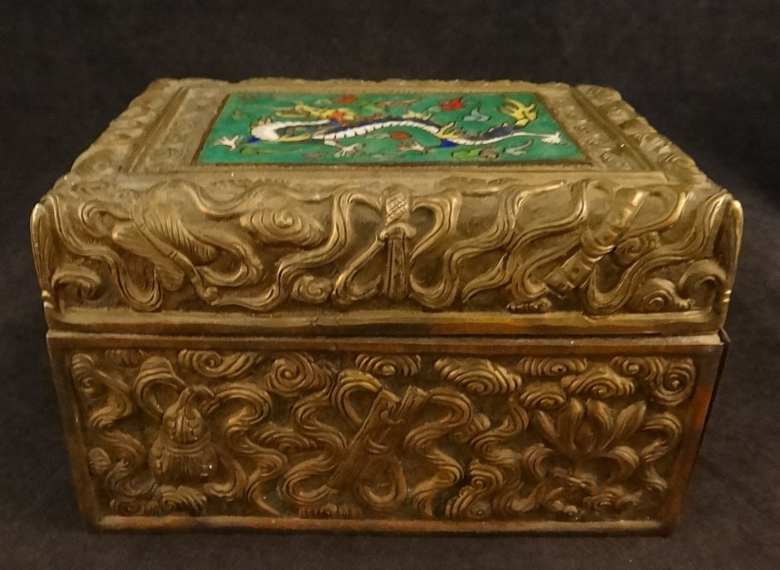 Antique Chinese Repoussé Brass Box w/ a Cloisonne Dragon: Antique Chinese Repoussé Brass Box with Precious Objects amid Clouds with a Cloisonne Dragon amid clouds panel on top. Wood lined. 2nd half 19th cent. Measures 3 7/8” x 2 5/8” x 2