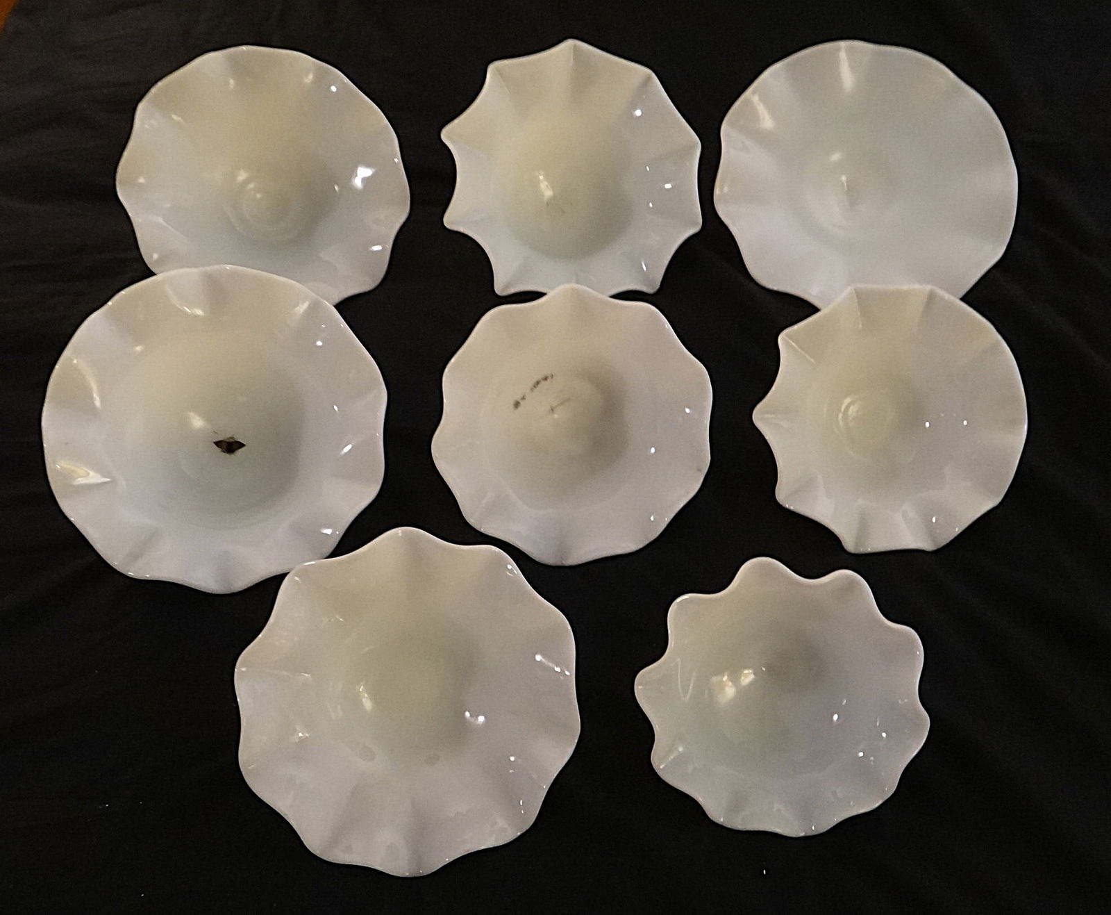 8 - 1800’s Blown Milk Glass Kerosene Lamp Smoke Catchers.: Set of 8 - 1800’s Blown Milk Glass Kerosene Lamp Smoke Catchers. 8”, 7” with colored edge, 7”, 6 ½”, 2 – 6”, 5”, 3 3/8” bell shaped.