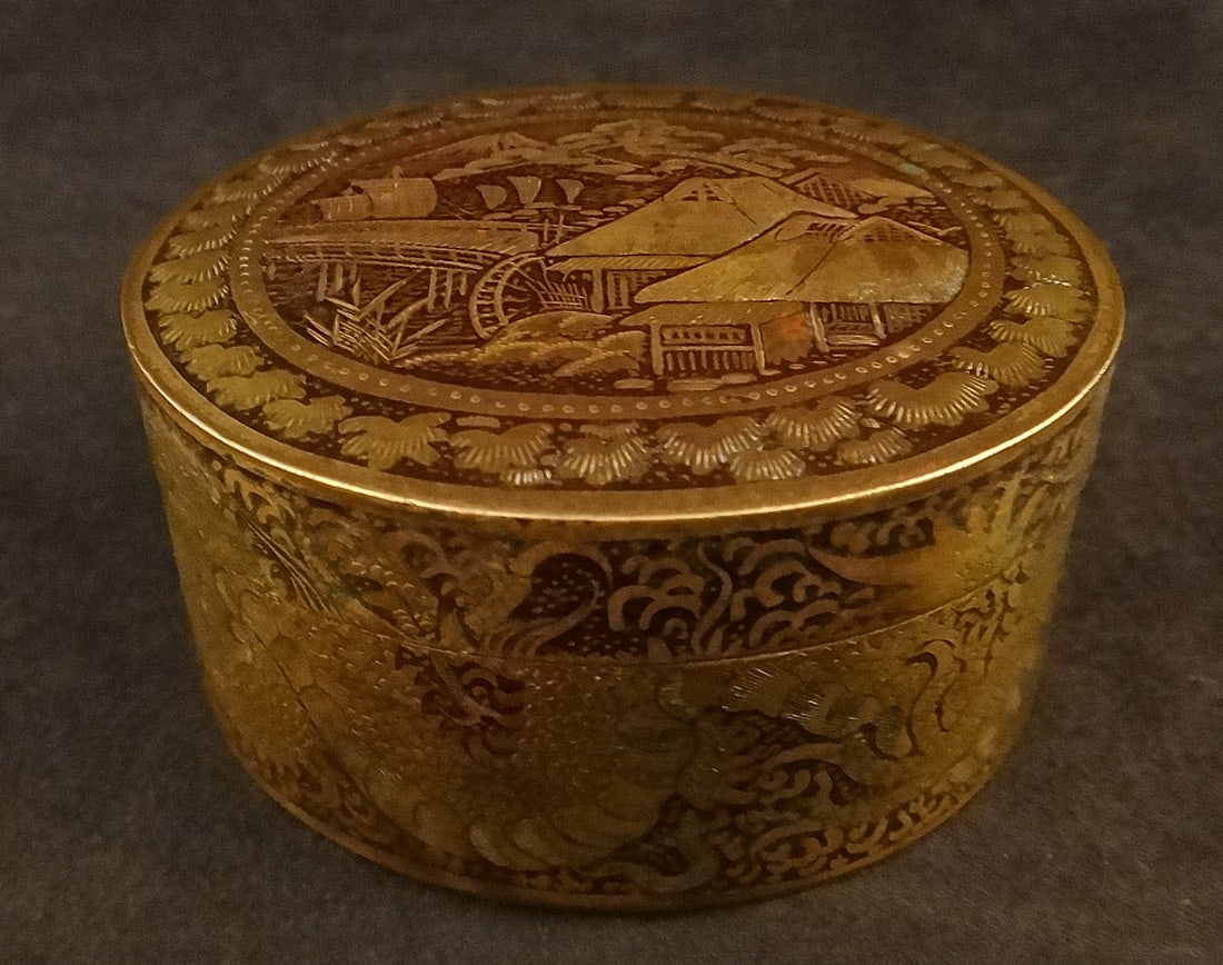 Antique Meiji Japanese Gilt Brass Box with Enamel Scenes.: Antique Japanese Gilt Brass Box with Enamel. The Main scene of houses, bridge & Mt. Fuji in the background. Sides are of a dragon. Meiji period (1868-1912). 2 3/8” x 2” x 1 3/16”