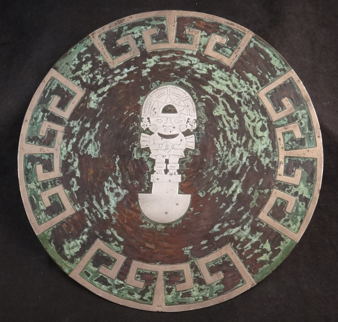 Original Peru Copper Charger with heavy Sterling God: Original Peru Copper Charger with heavy Sterling God & Geometric Designs. 10” dia. Hanging hook on back. Circa Mid-20th C.