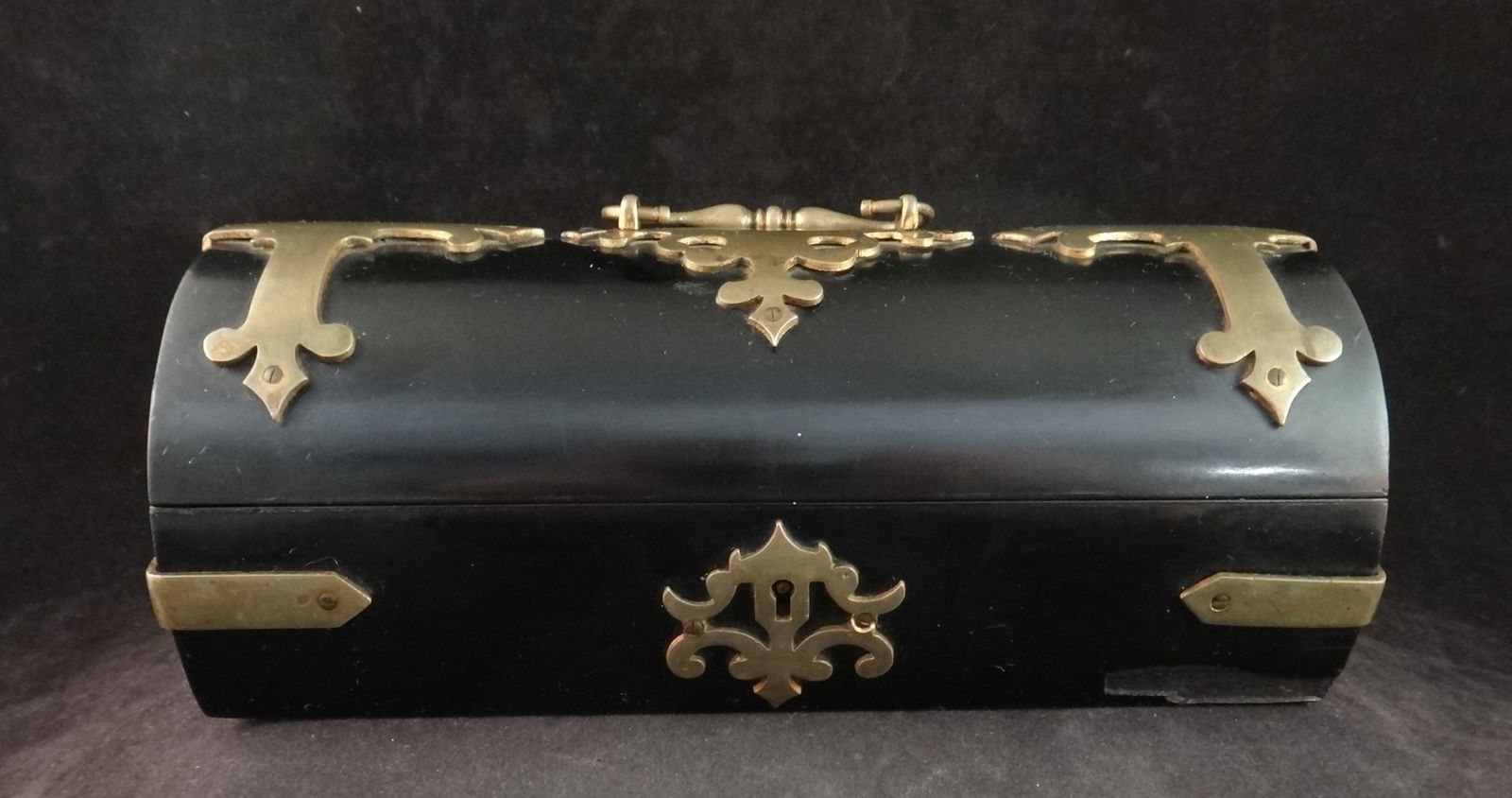 Antique English Arts & Crafts Domed Box w/Brass décor: Very Rare Antique English Arts & Crafts Domed Box with thick solid brass decorations on a gutta-percha base. Paper covered wood bottom. 4th Qtr. 19th c. 9 ¼” wide x 5” tall (w/handl