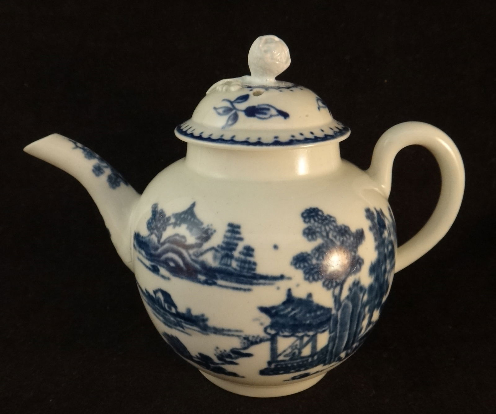18c English B&W Teapot / Man in a Pagoda Lake scene: 18c English Blue & White Teapot featuring a Man in a Pagoda Lake scene on each side. Circa 1760-1780. Unmarked, but probably Dr. Wall Period Worcester. Measures approx. 4 ¾” tall &