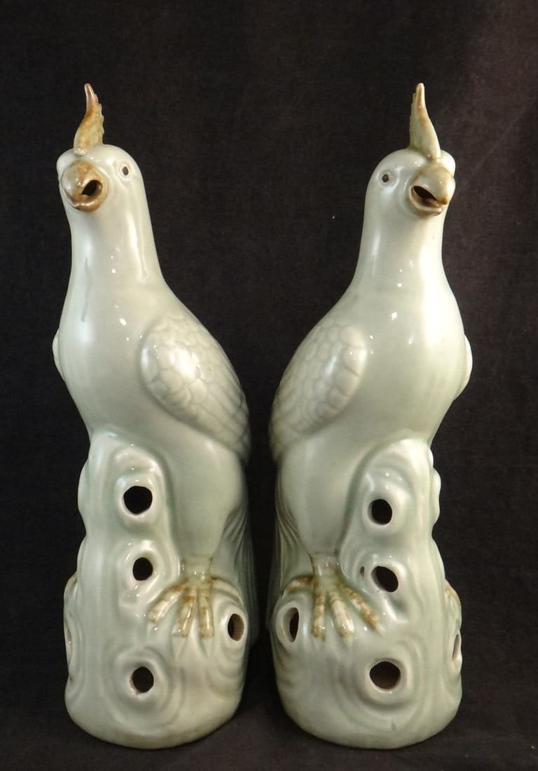 Pr. Antique Chinese Porcelain Parrots in jade green glaze: Pair of Antique Chinese Porcelain Parrots in jade green glaze on pierced bases. Qing Dynasty – c.1860-1912. Measure approx. 11 ¾” tall x 3 ½” wide x 4 ½” deep.