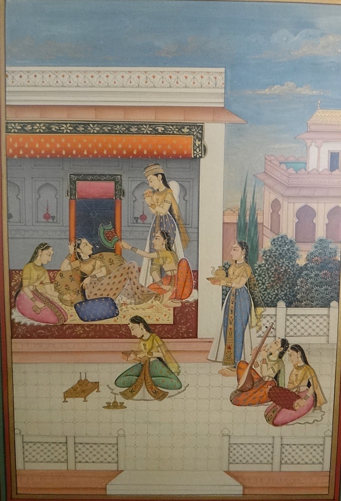 Antique India Miniature Painting on Paper - Harem or Court Scene: Antique India Miniature Painting on Paper in the Mugal style of a harem &/or court scene with 7 young woman & 1 young man all in fine attire. Wide floral hand painted border. Late 19th/early 20th cent