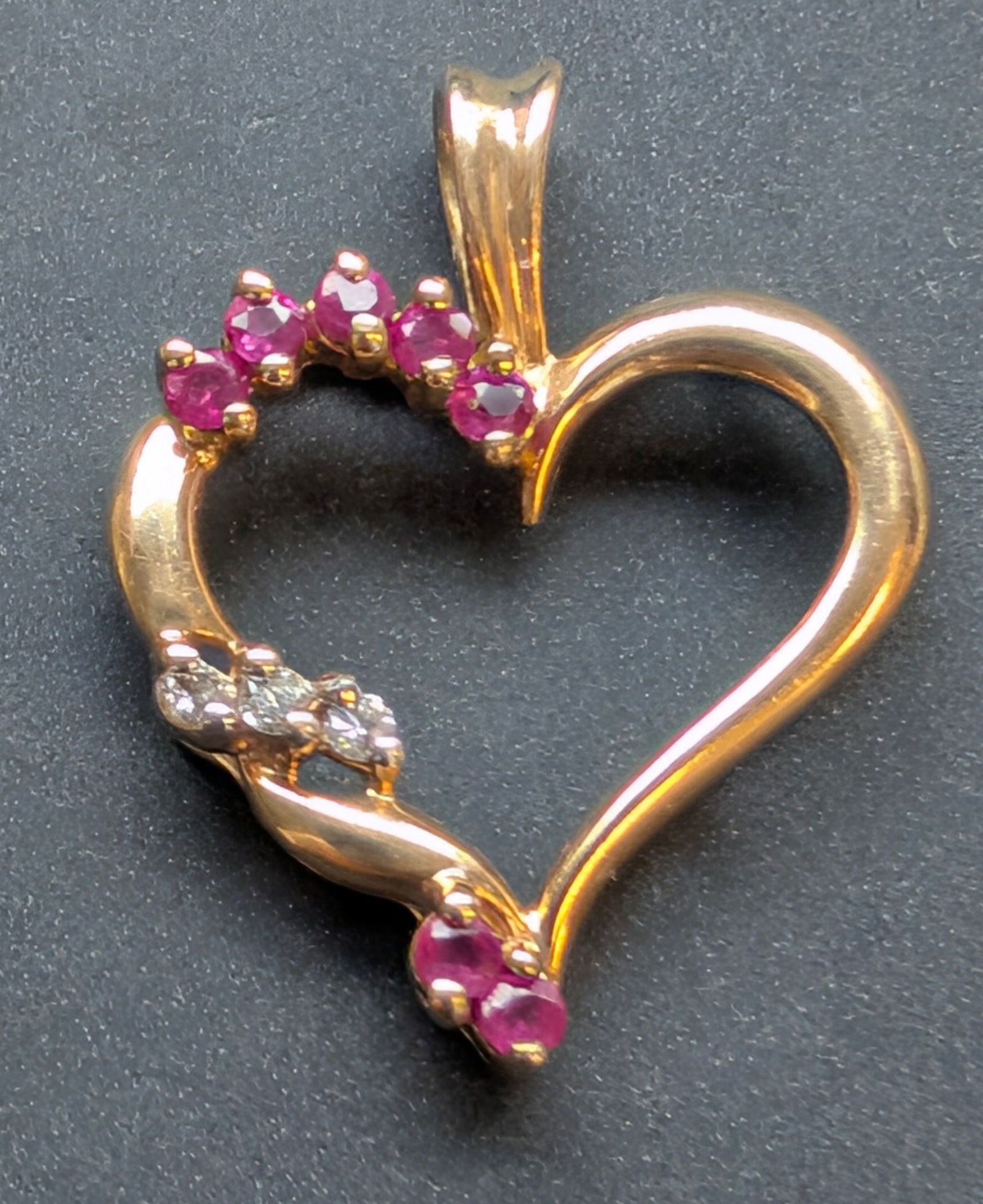 Vtg 14k gold heart shaped pendant w/diamonds & natural rubies.: Vintage 14k yellow gold heart shaped pendant set with 3 faceted diamonds & 6 faceted natural rubies. 25mm x 20mm, weighs 1.9 grams.