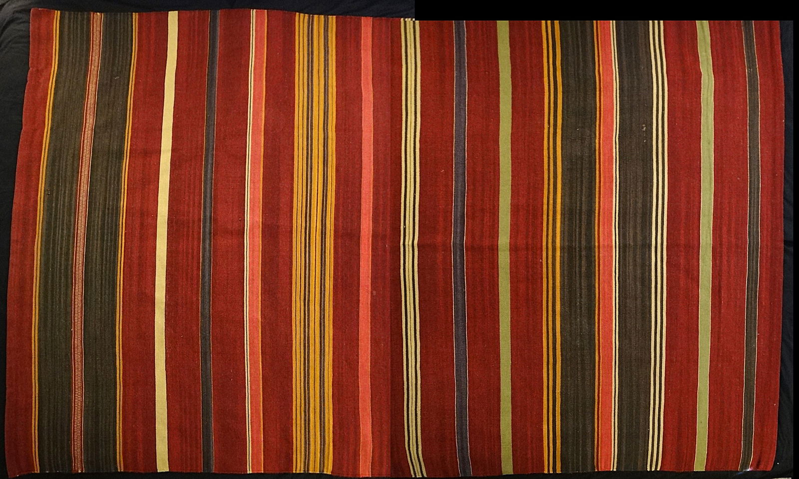 Vtg. North American Indian Hand Loomed Sheep Wool Rug: Vintage North American Indian Hand Loomed Sheep Wool Rug with Bands & Panels of colors of brick red, green, yellow, orange, blue & Natural. Measures 60” x 35”.