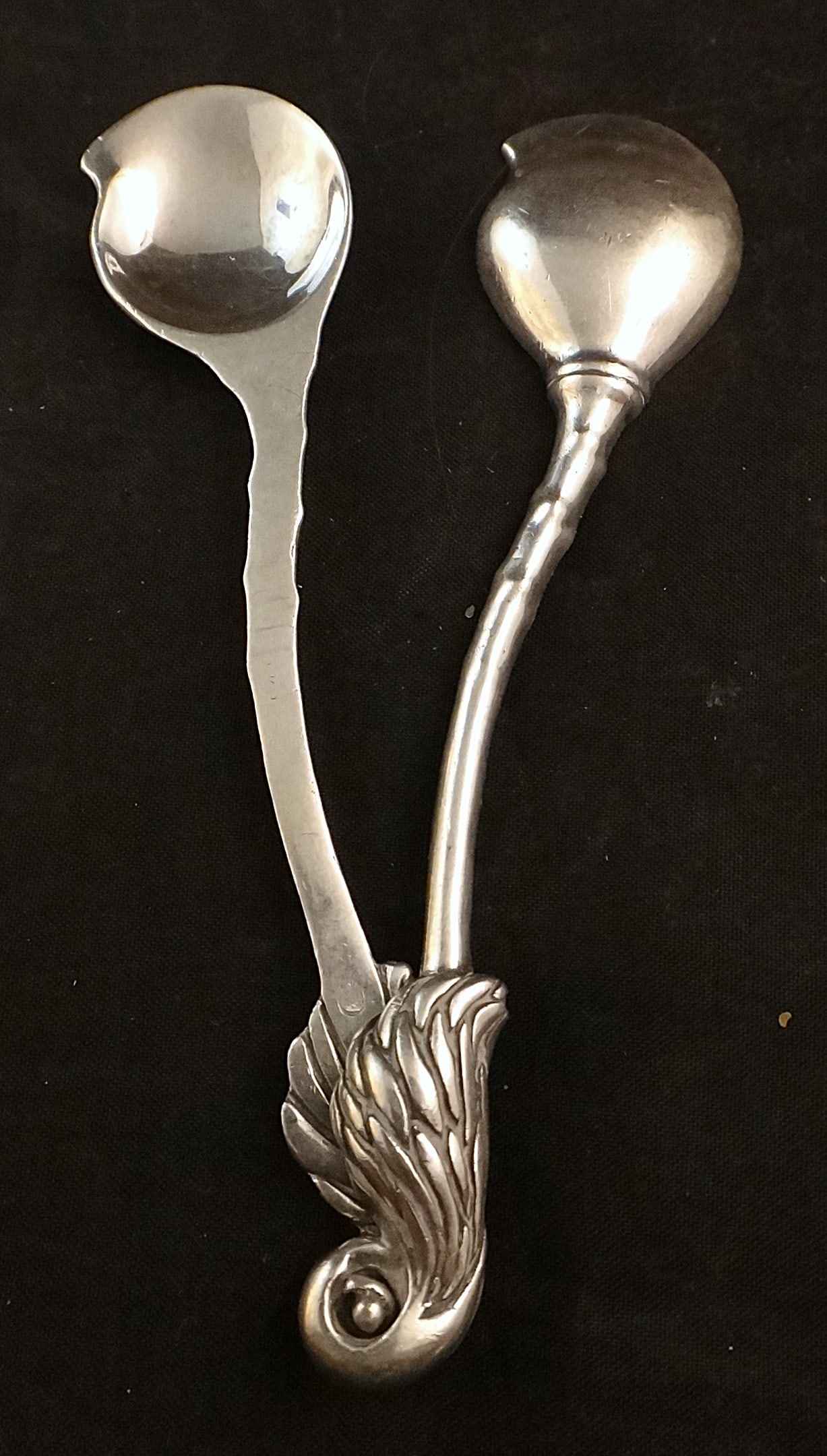 Pr. Mid-c. European Sterling Silver Spoons w/Leaf form handle: Pair of mid-cent European Sterling Silver Spoons with Leaf form handle ends & shaped bowls. Hallmarked on handle. 4 1/8” long, 41.7 grams.