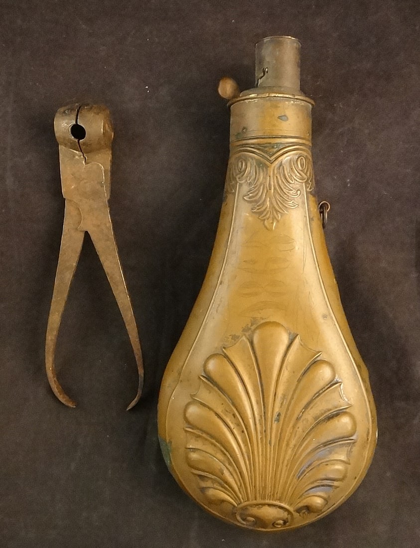 Civil War Era Copper Powder Horn and Civil War era Iron Bullet Mold: Civil War Era Copper Powder Horn with Shell Design – Dated 1865 (etched) with 3 attachment holes. 8 ¼” long x 3 ½” wide. Together with a Civil War era iron bullet mold (bul