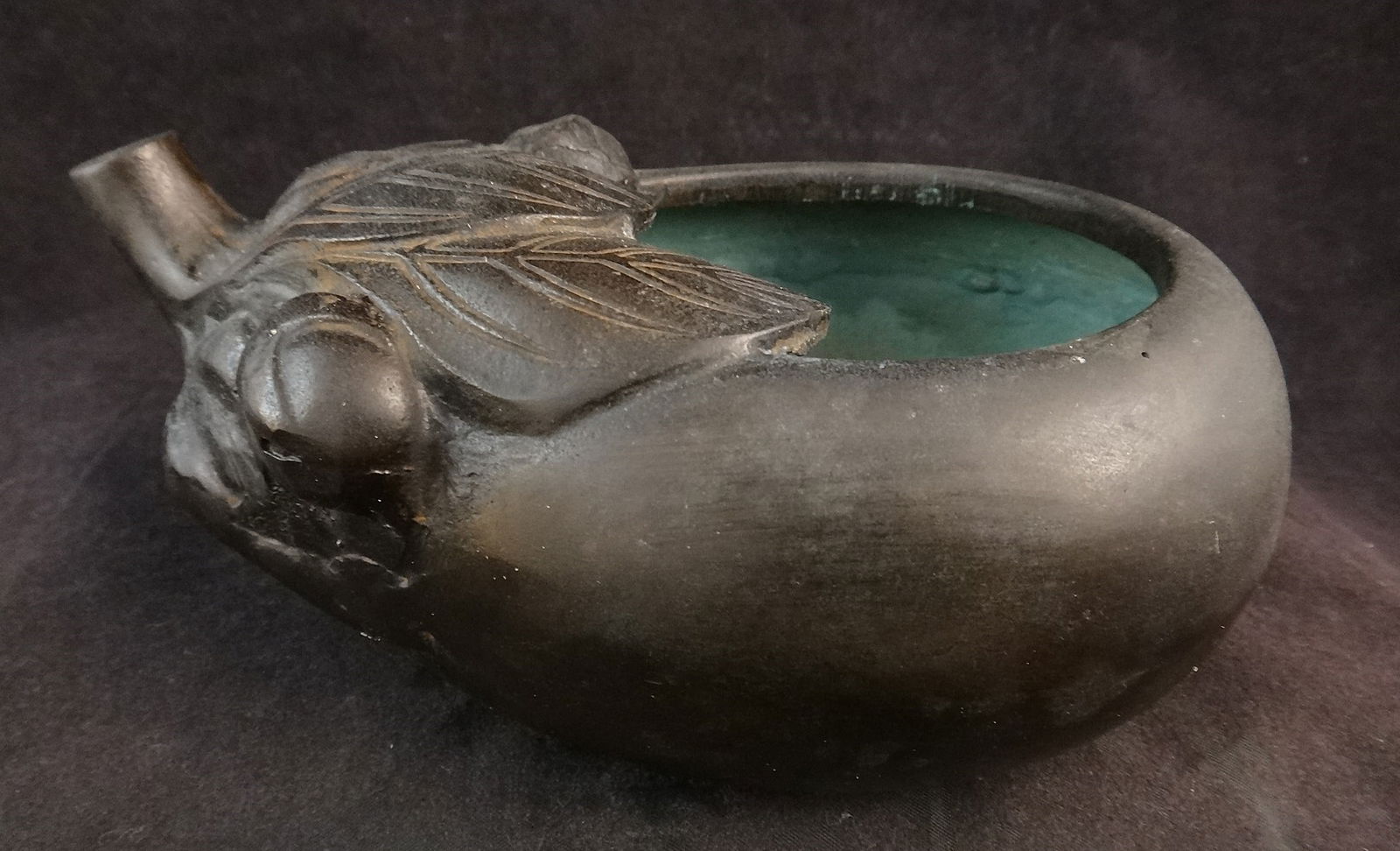 Antique Japanese Bronze Flower Vase – eggplant design: Antique Japanese Bronze Flower Vase in the form of an eggplant with stem & leaves. Meiji period (1868-1912). 6 ¼” long x 2 ½” tall x 4” deep. Holds water.