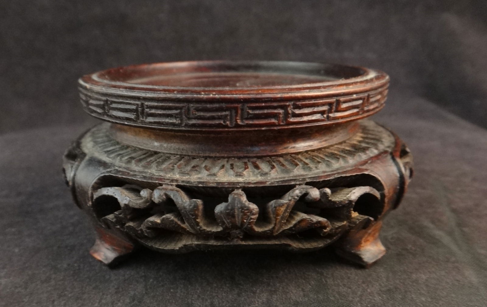 Antique Chinese Carved Rosewood Vase/Bowl Stand on 4 feet: Exceptional Antique Chinese Carved Rosewood Vase/Bowl Stand on 4 feet with finely carved & pierced Floral apron. Qing Dyn. (1860-1912). 3 ¼” x 1 ½” tall. Inside dia. is 2 3/8