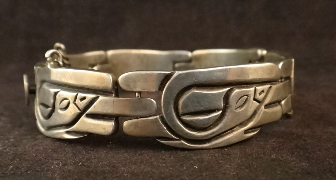 Mid-Cent. Mexican J. Flores Taxco Sterling Silver Bracelet: Mid-Cent. Mexican J. Flores Taxco Sterling Silver Bracelet with 6 sections of bird motifs. Approx. 7” long- 2 ½” dia. Stamped: J. Flores, Taxco mex 925. 50.4 gr.