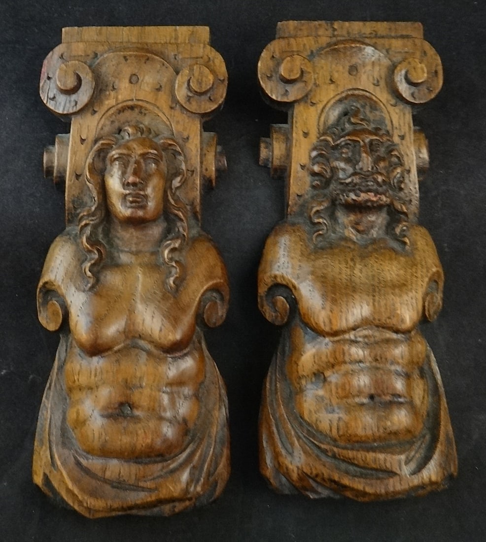 2 Antique Flemish Carved Oak Caryatids, Man & Woman: 2 Antique Flemish Carved Oak Caryatids, Man & Woman with scroll tops. Very finely carved. 18th/19th cent. 8” tall x 3” wide x 1 ½” deep.