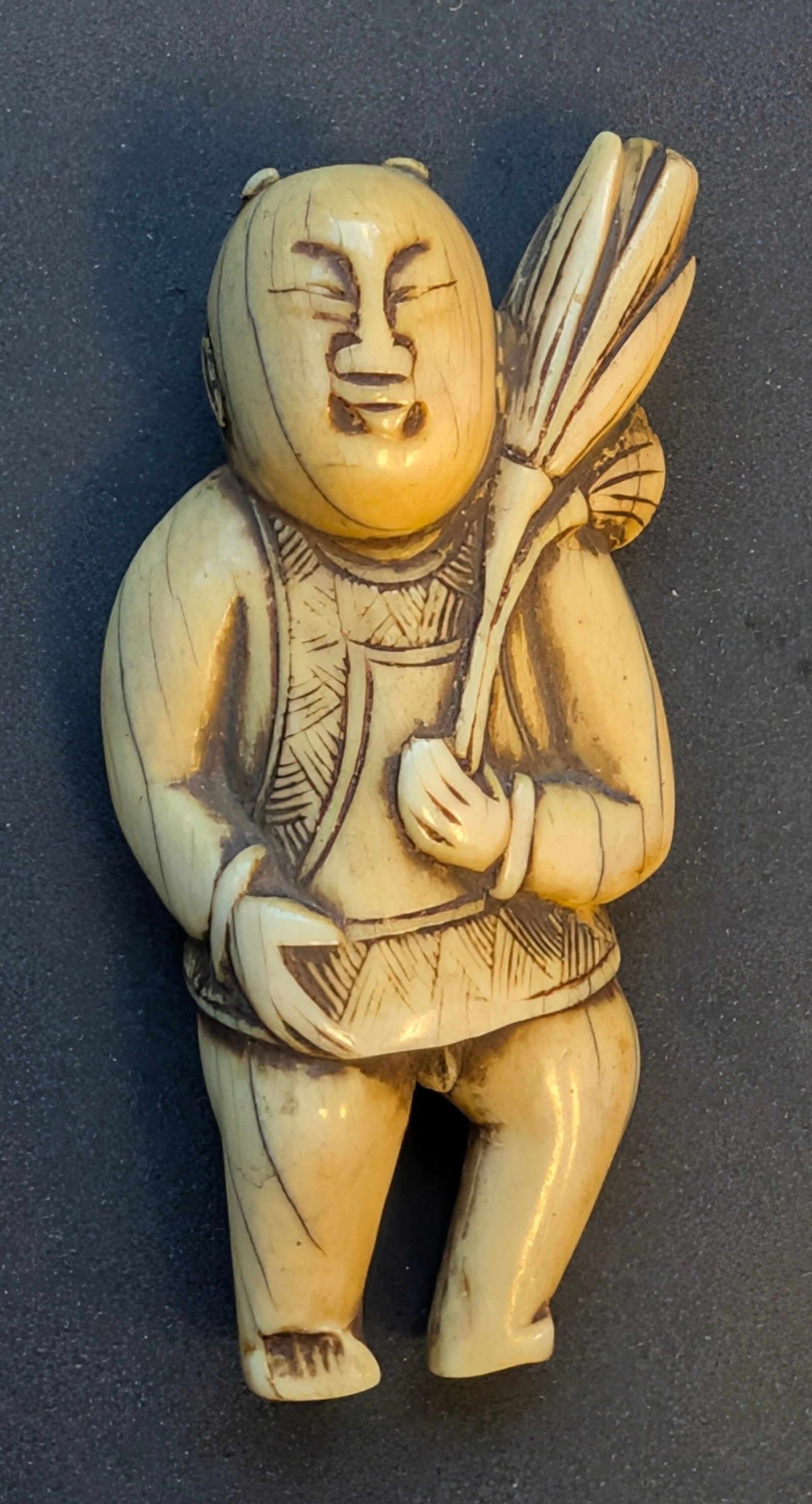 Lt. 18th c. Chinese Carved Guajian Belt Toggle or Necklace Fertility Amulet - form of a boy.: Late 18th C. Chinese carved Guajian Belt Toggle or Necklace Fertility Amulet in the form of a boy. A hole from the top thru the bottom for a cord. 2" tall.