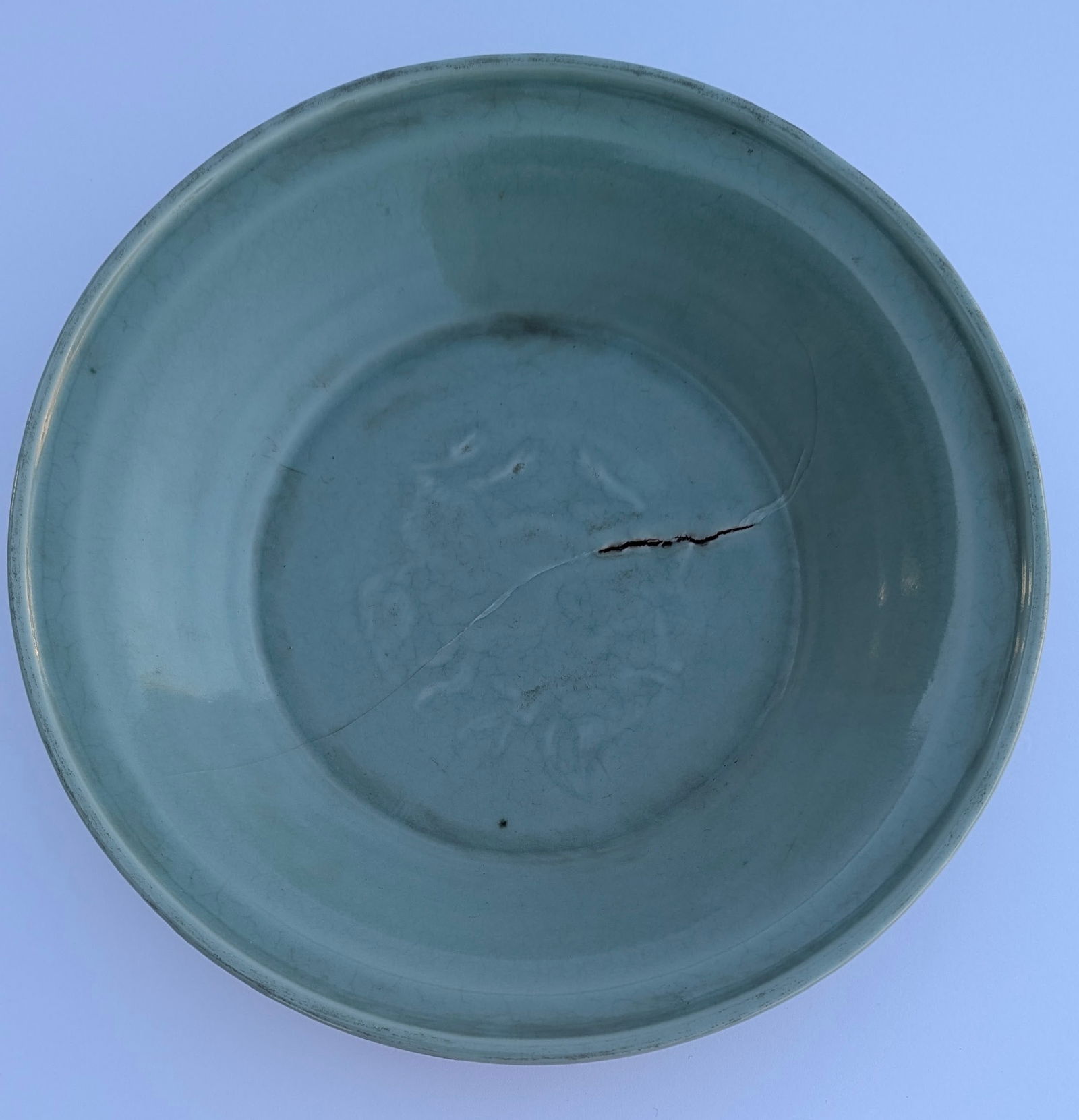 Lg. Chinese Ming Dynasty Longquan Celadon Glaze Porcelain Bowl.: Large Chinese Ming Dynasty Longquan Celadon Glaze Porcelain Bowl. Features a raised decoration of a lotus flower in the center. 15th/16th cent. Measures 12” dia. x 2 ½” tall.