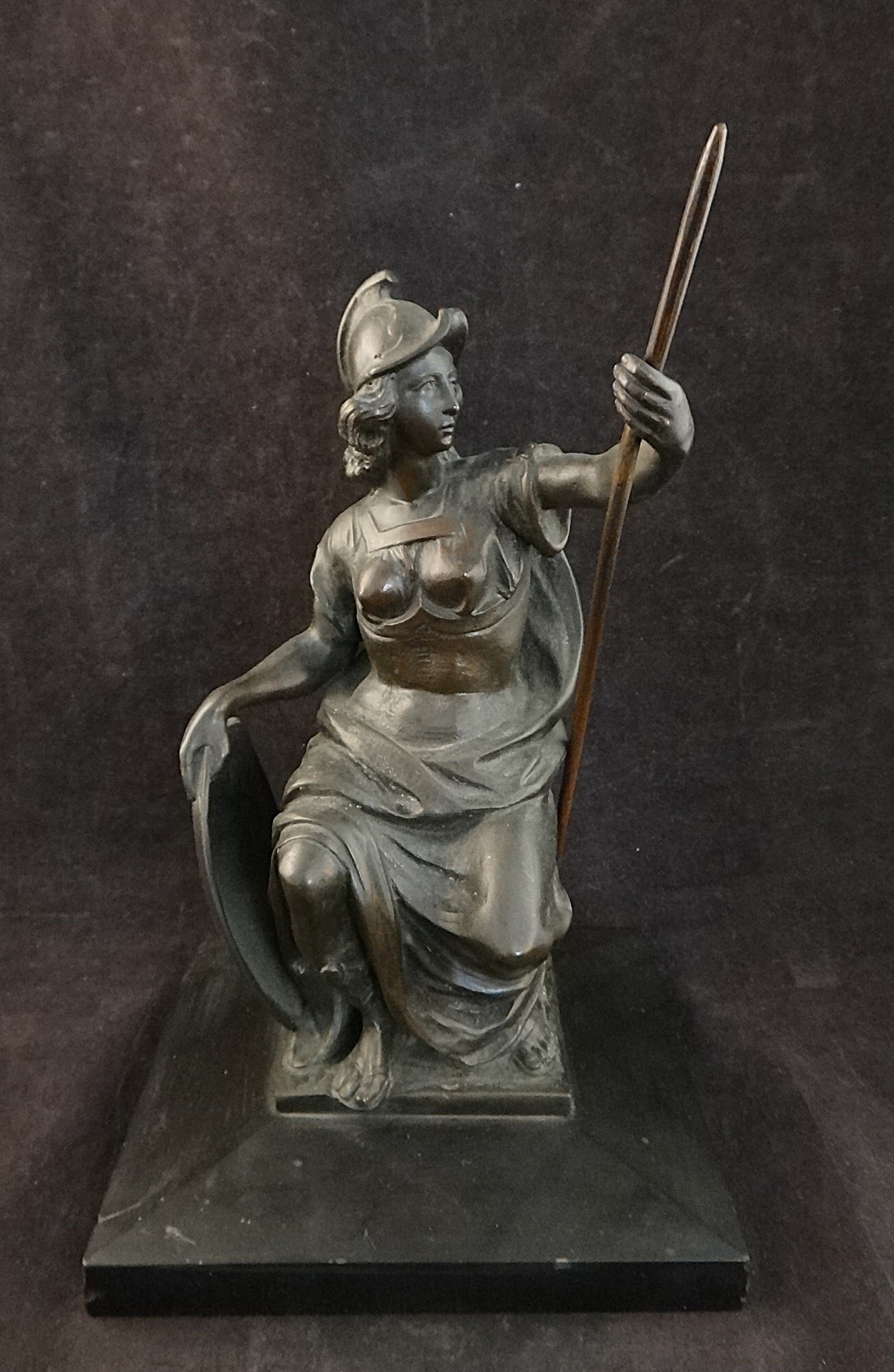 Antique European Bronze of Athena by Fritz Kollmeyer.: Antique European Bronze of Athena by Fritz Kollmeyer. She is holding a spear & shield wearing helmet. c. 1900. On the original black onyx base. 9 ½” tall, base is 6” x 6”