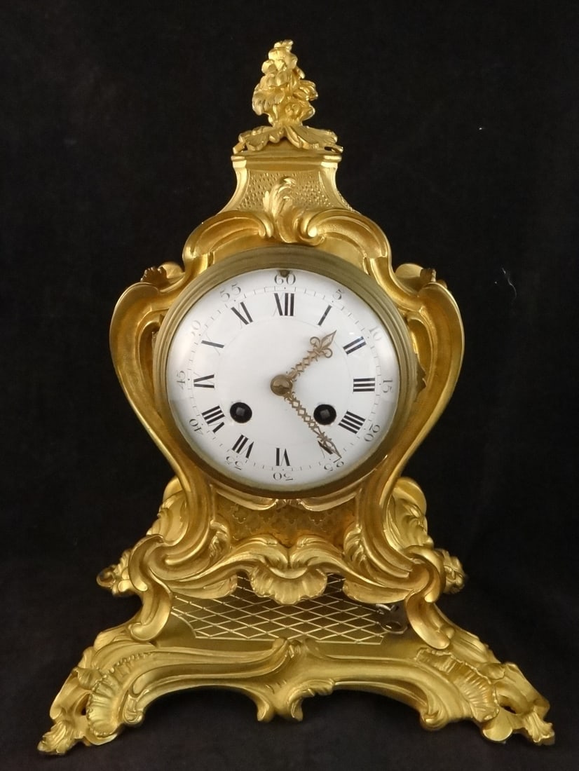 Antique Tiffany & Co. Charles Hour, France - Bronze Gold Mantle Clock.: Antique Tiffany & Co Charles Hour, France - Bronze Gold Mantle Clock. Louis XV rococo style on attached stand, enameled face - Roman numeral hour hands & Arabic numbers on the outside rim. Stamped C.H