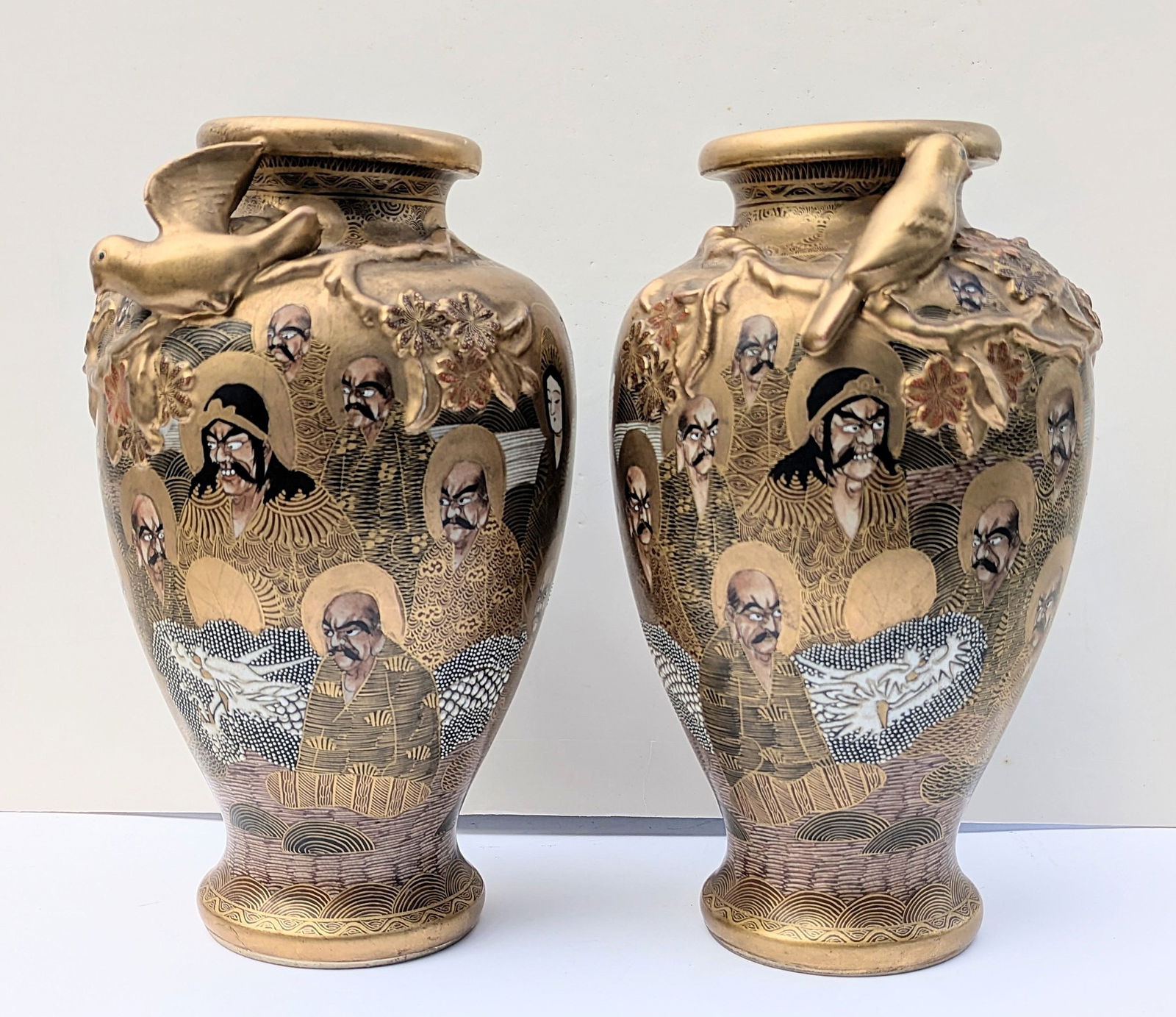 Pr. Antique Japanese Satsuma Vases by Kitamura Yaichiro.: Pair of Very Fine & Rare Antique Japanese Satsuma Vases by Kitamura Yaichiro. Beautifully painted immortals with white enameled dragons flow between the immortals. Applied birds & branches adorn the v
