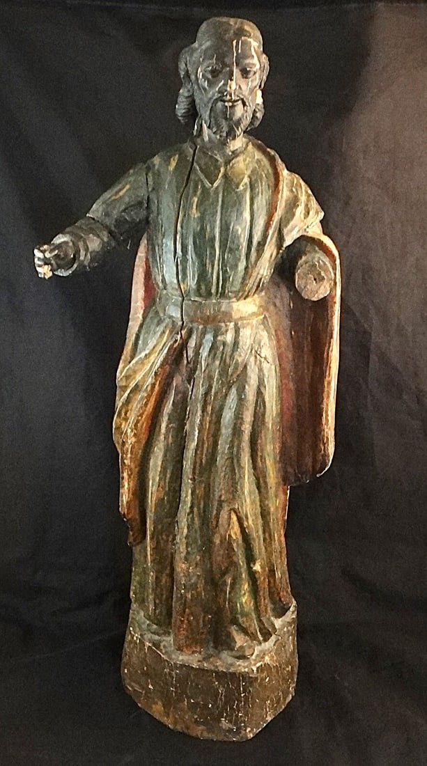 18th/19th c. Spanish Colonial Carved Wood Santos: 18th/early 19th c. Spanish Colonial Carved & painted Wood Robed Santos of a bearded figure with right arm extended. 22” tall x 6” dia. base.