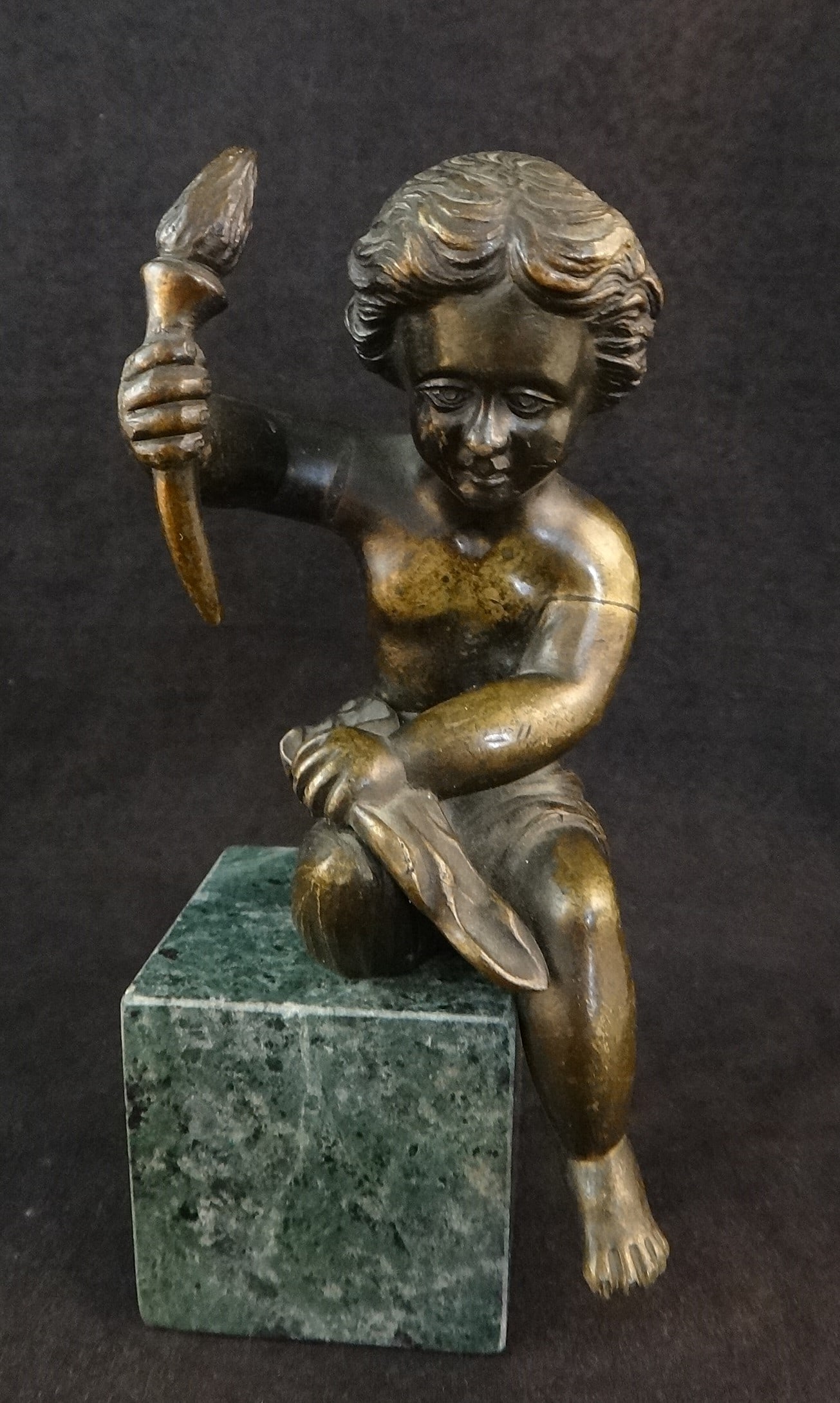 19th c. French Grand Tour Bronze Cherub: 19th cent. French “Grand Tour” Bronze Cherub. Sitting and holding a torch. Original 2 mount holes on bottom, Includes a later marble block. Overall height with block is 6 ¼”.