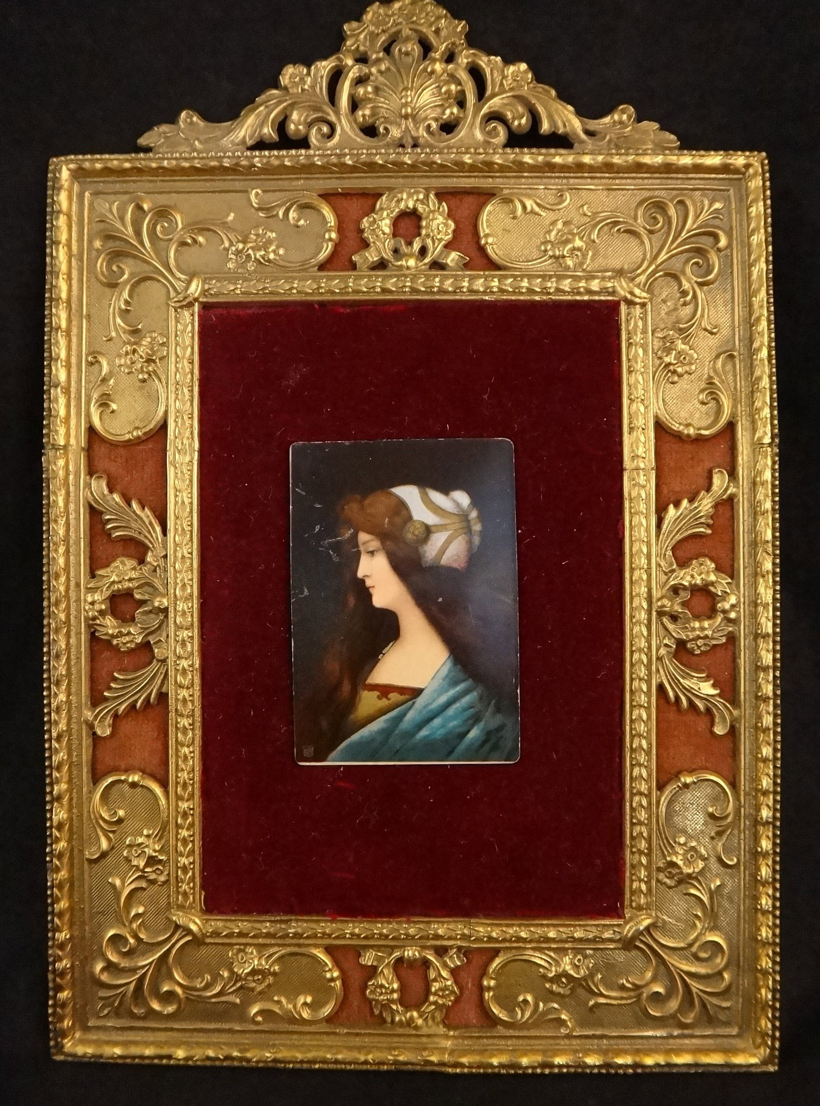 Female painting in gold frame with red velvet backing. (1 of 5)