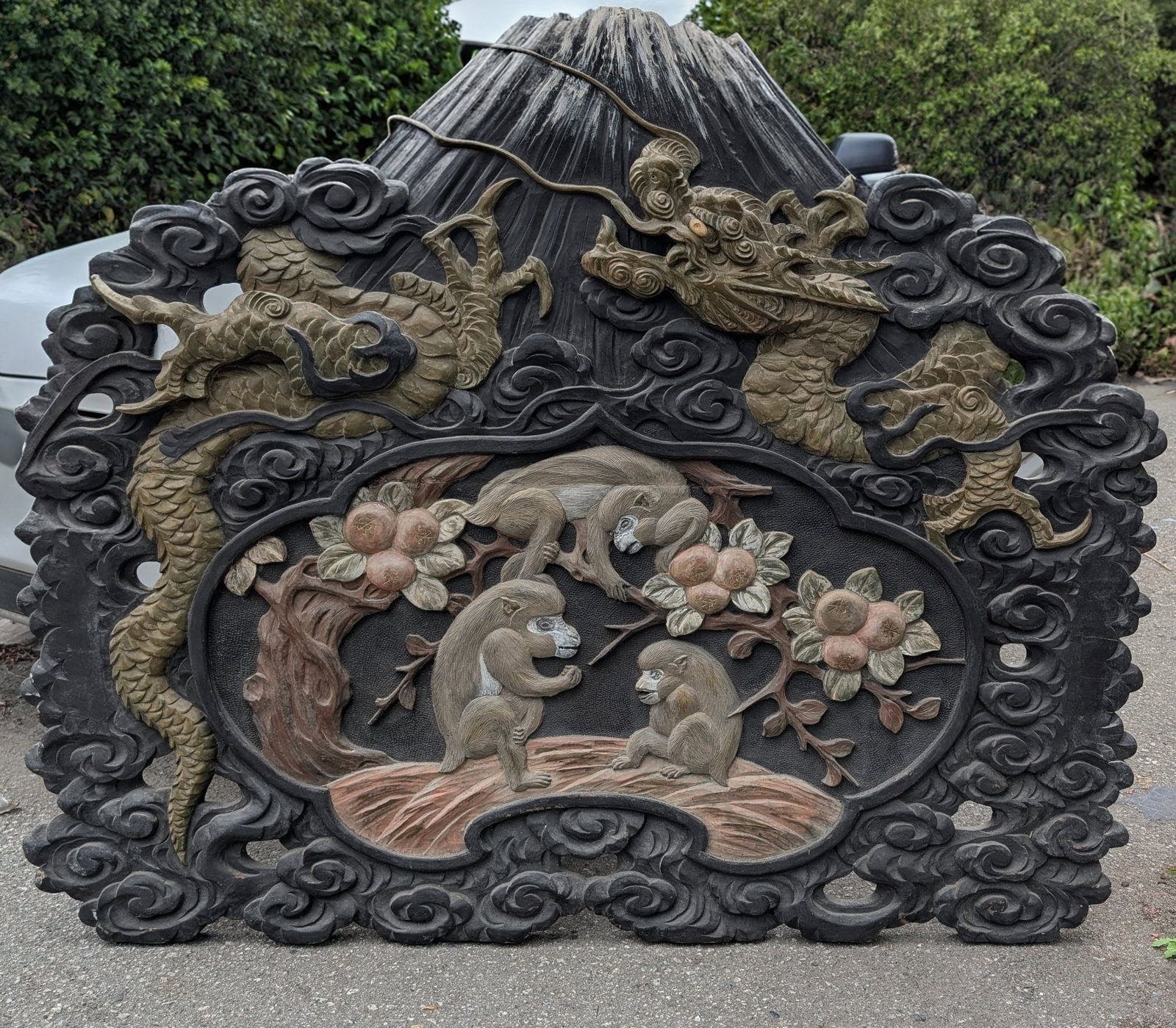 Lg Japanese Carved & Painted Wood Panel w/Gold Dragon & Mt. Fuji: Large Japanese Carved & Painted Wood Panel with a Gold Dragon Circling Mt. Fuji & a Cartouche of 3 Macaque Monkeys in a Fruit Tree. Late Meiji period (1868-1912). 50" wide x 42" tall x 2 1/2" deep.