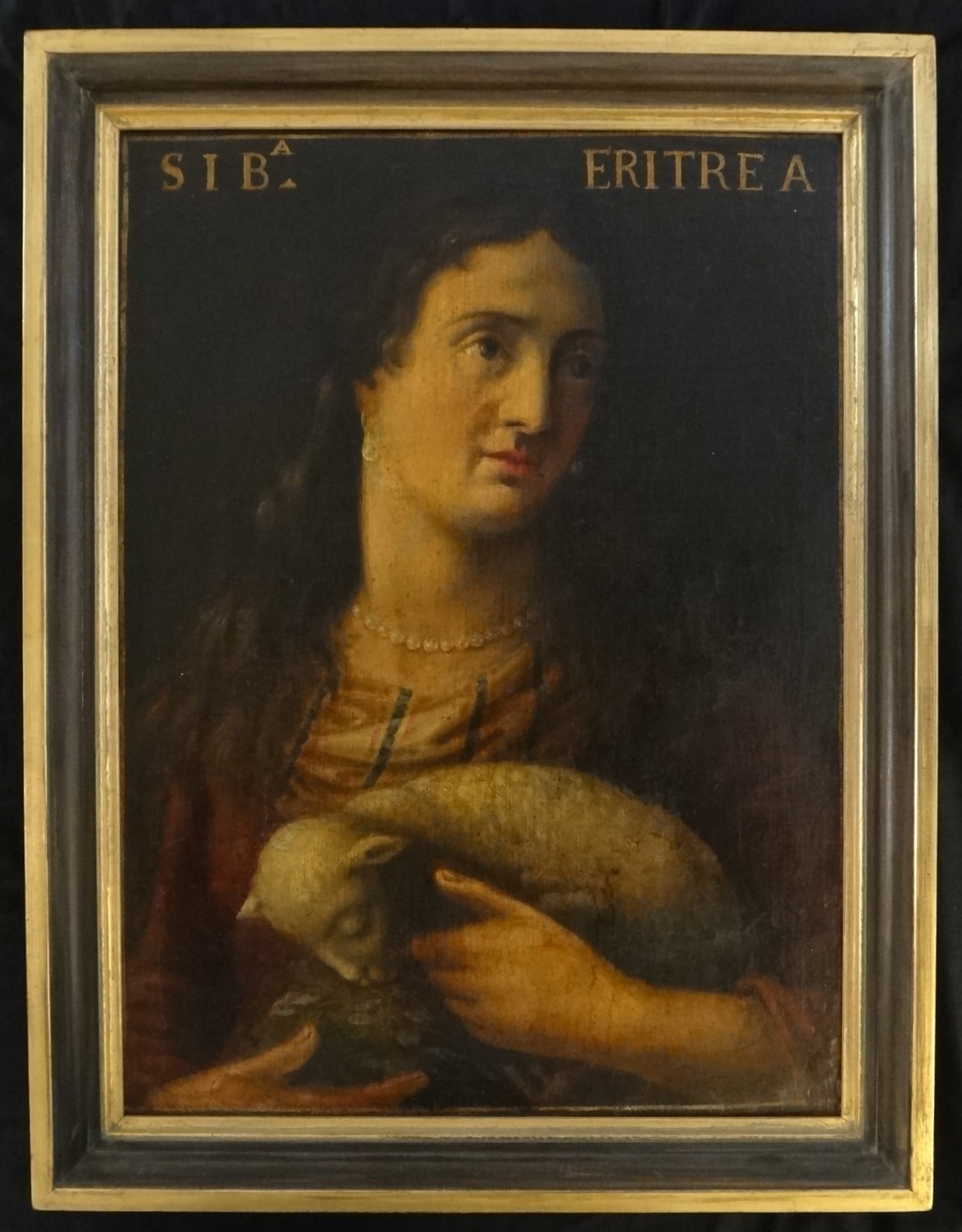 Lt. 18th C. Italian Oil of prophetess Sibyl of Arithrea holding a Lamb.: Late 18th C. Italian Oil on Canvas of Sibyl of Arithrea holding a Lamb. Sibyl of Arithrea was an ancient prophetess and presided over the Temple of Apollo in Ionia. She proportedly foretole the coming