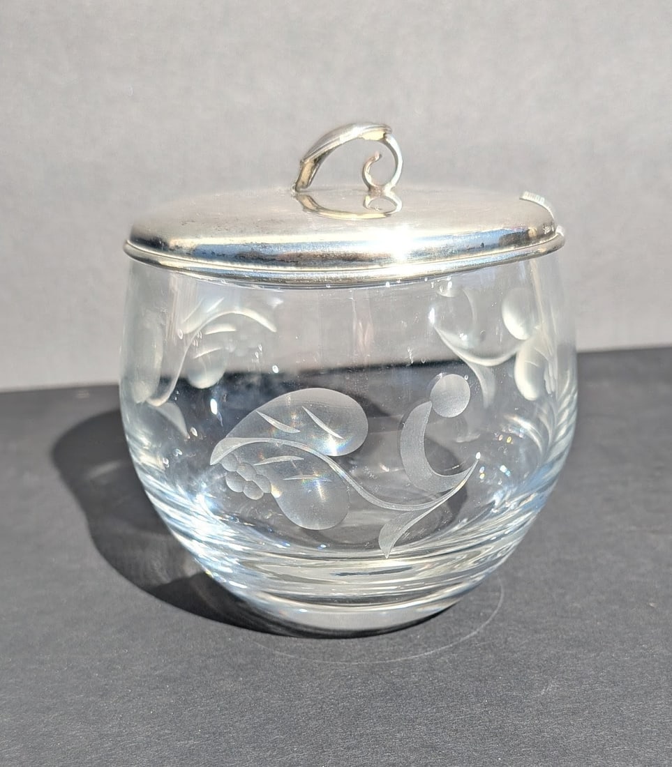 Vintage Cut Crystal Jam Jar with Cut Design & Sterling Top: Vintage Cut Crystal Jam Jar with Cut Leaves and Fruit Design on 3 Sections. Sterling Top with Leaf Handle. 2nd quarter 20th C. 3 3/4 " tall x 3" dia. Sterling top weighs approx. 1 oz.