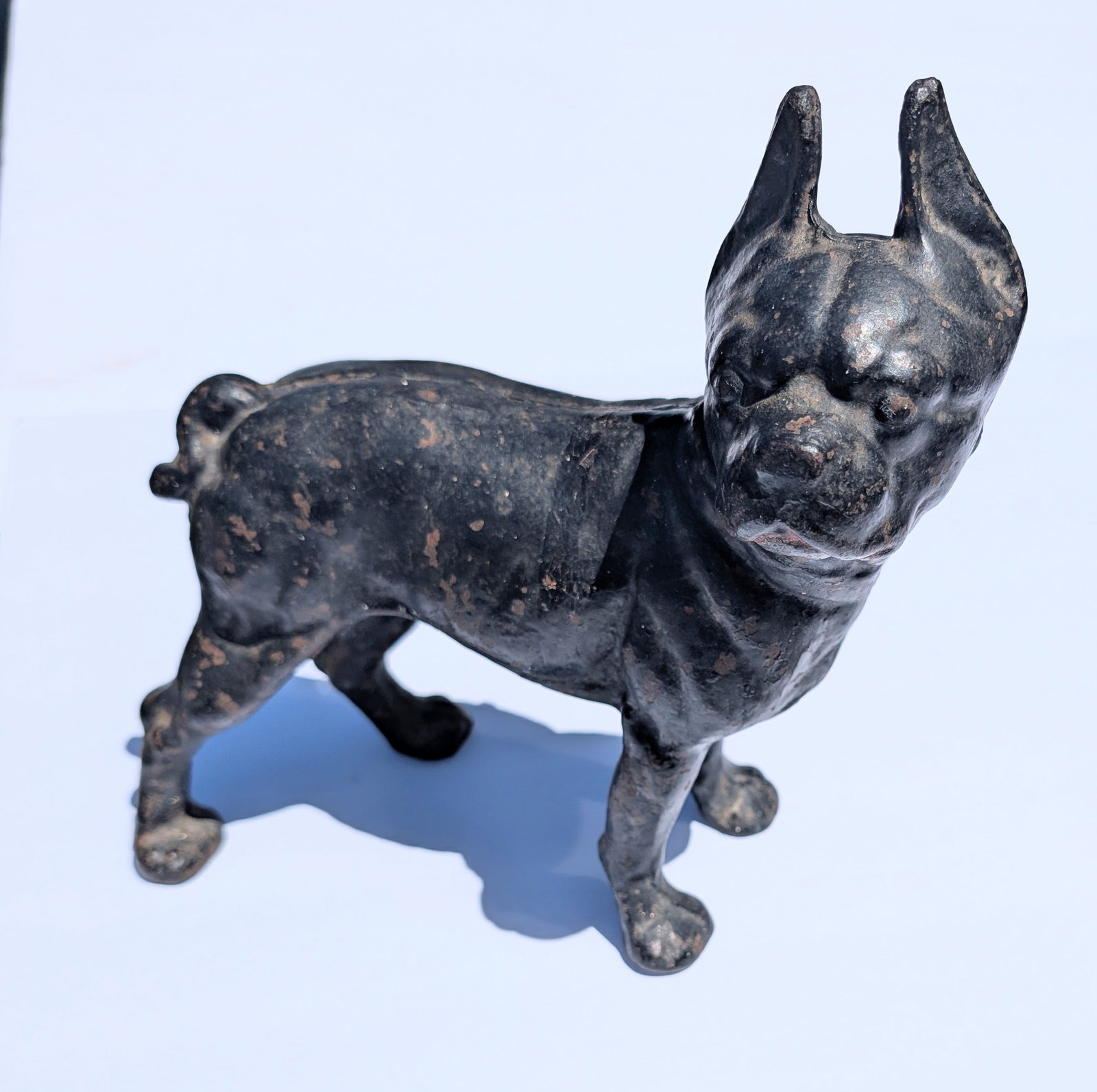1930's Hubley Cast Iron Boxer in Original Black Paint: 1930's Hubley Cast Iron Boxer in Original Black Paint. 10" tall x 10" long x 4.5" deep. Heavy at 8 lbs 8 oz.