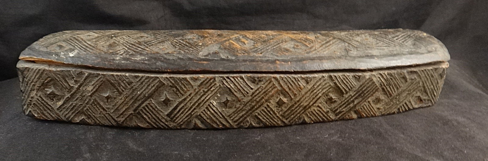 Antique African Kuba Tribe Carved Wood Tukula Cosmetic Box.: Antique African Kuba Tribe (Congo) Carved Wood Bow Shaped Tukula Cosmetic Box. Finely carved interwoven design, 19th/early 20th cent. 8”x 2” x 1 ¼” tall.