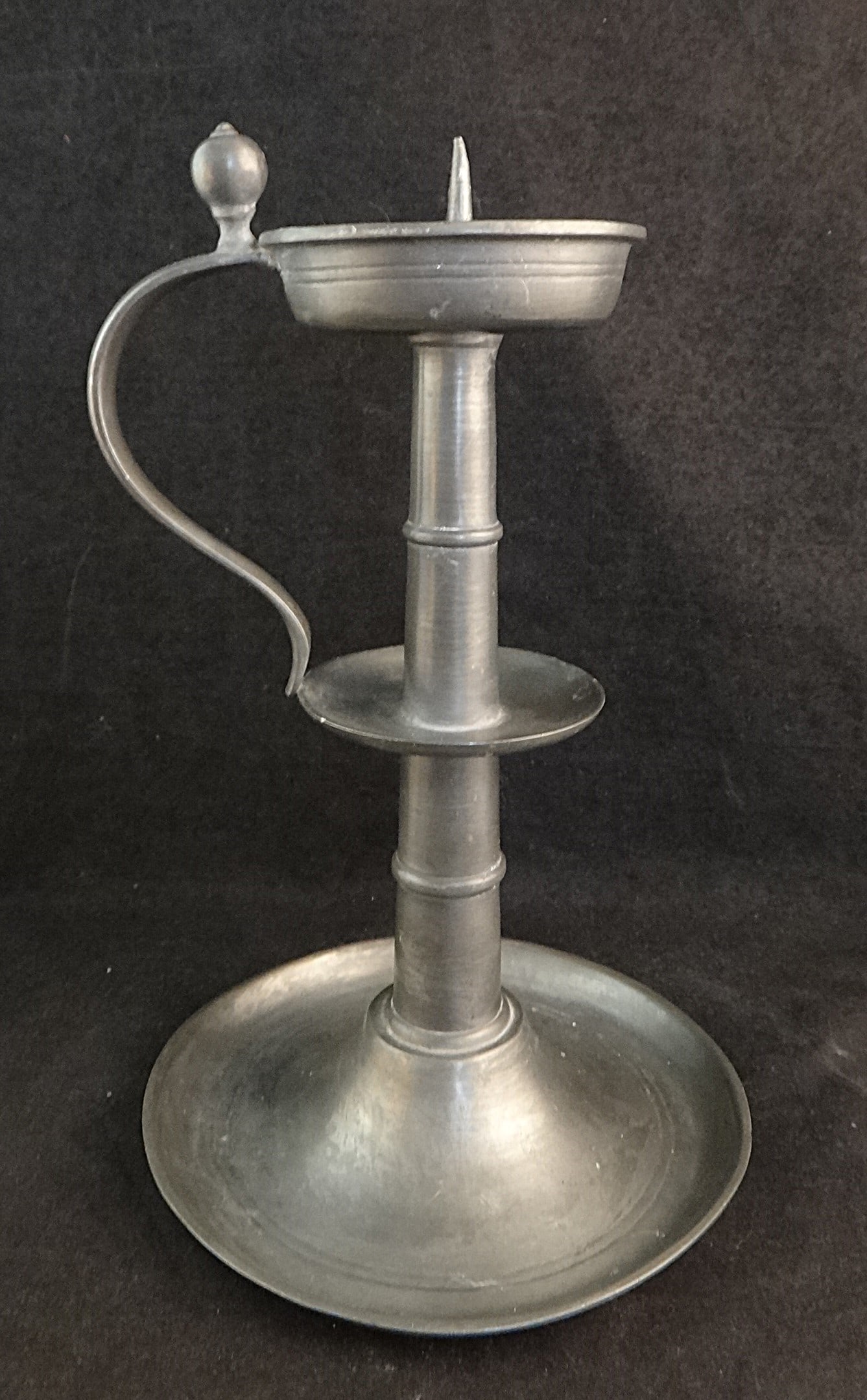 Antique Pewter Pricket Candlestick w/Handle, thumb piece & mid column drip pan.: Scarce Antique Pewter Pricket Candlestick with Handle, thumb piece & mid column drip pan. Late 18th/early 19th cent. 8 ¼” tall x 5 ¼” dia. base. Possible touchmark at bottom 