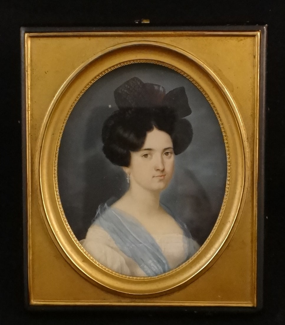 19th C. European Miniature Painting- Woman w/Black Hair & Back Bow: 19th C. European Miniature Painting of a Young Woman with Black Hair & Back Bow. She is in a White Dress with Blue Trim around her neck. 1st half 19th C. 2 ½” x 2”. In very good con