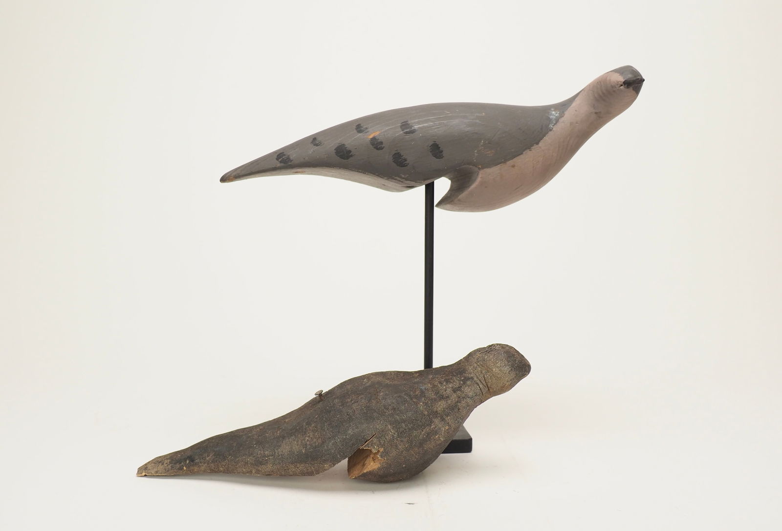 Pair of unknown dove decoys: Pair of dove decoys notched to be able to sit on the egde of a fence. Measuring 12.25 & 9.75" long