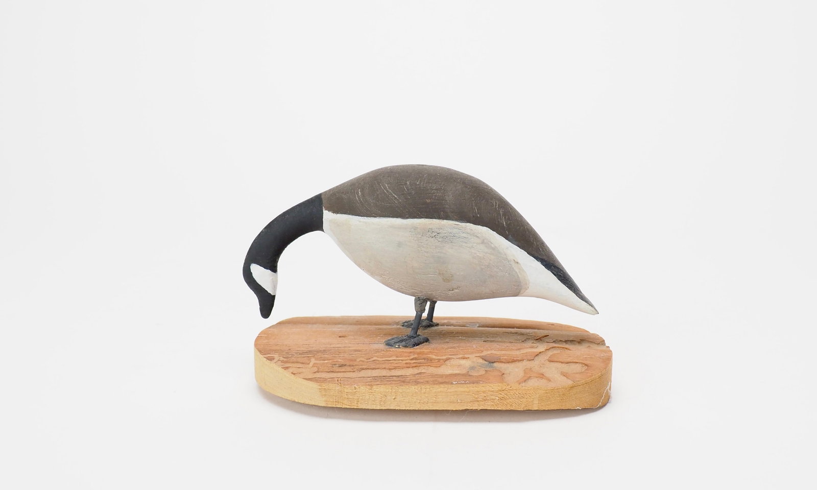 Miniature Feeding Goose - Hurley Conklin: Hurley Conklin (1913-1983) Manahawkin, NJ 5" long Feeding canada goose on a wood base. "Blind" with no carved or painted eyes. Signed on the bottom.