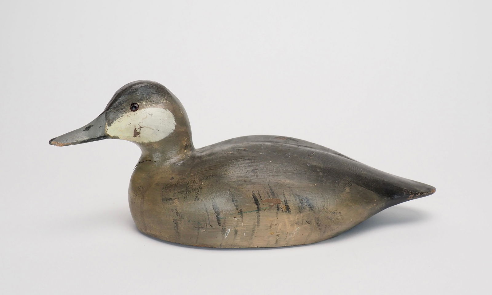 Ruddy Duck - William "Bill" Goenne: William "Bill" Goenne King City, CA 14" long Working Ruddy Duck in a swimming posture with the head turned slightly off to the left. Glass eyes and carved bill details. The underside has a line tie an